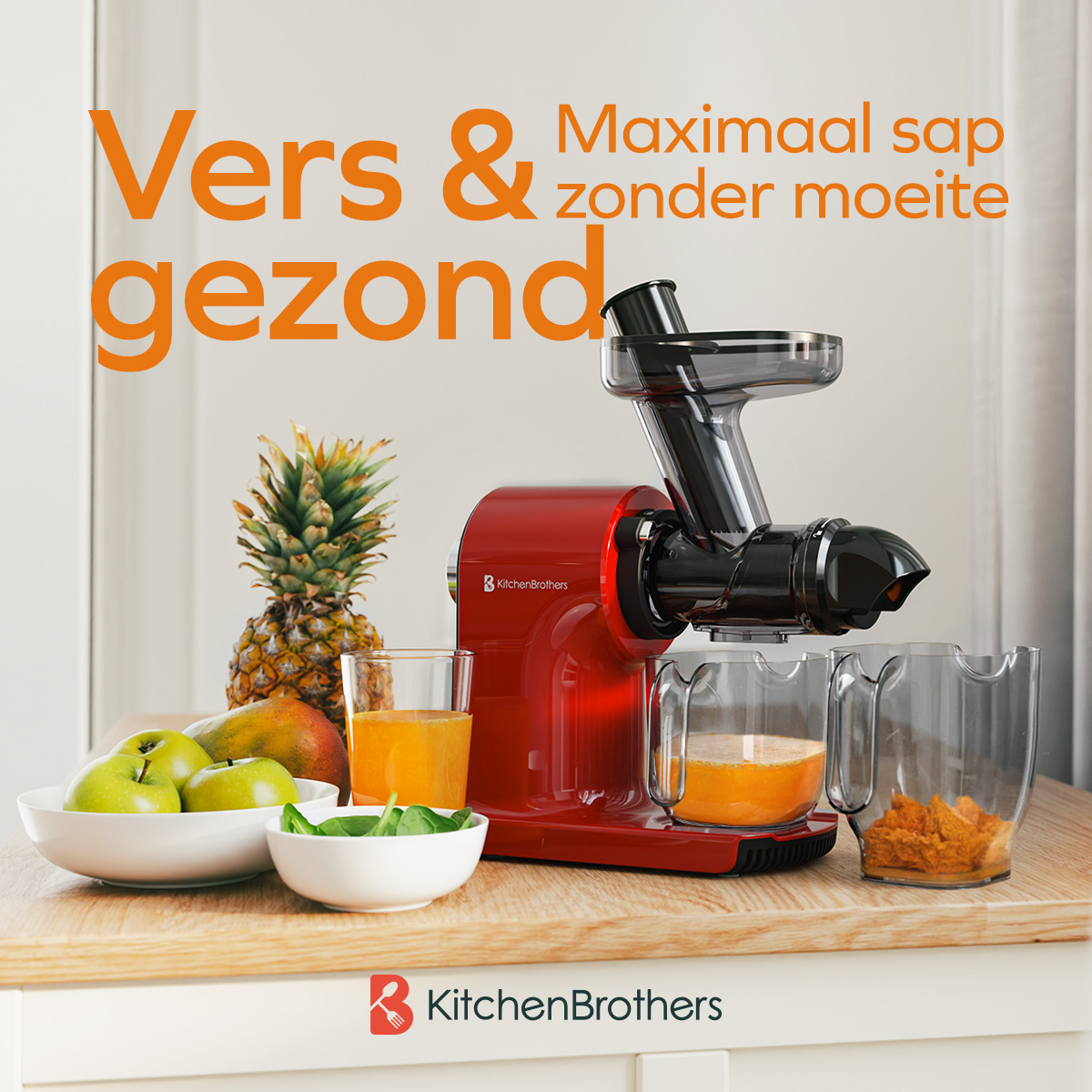 Red juicer with fruit, juice, and a pineapple on a wood surface.