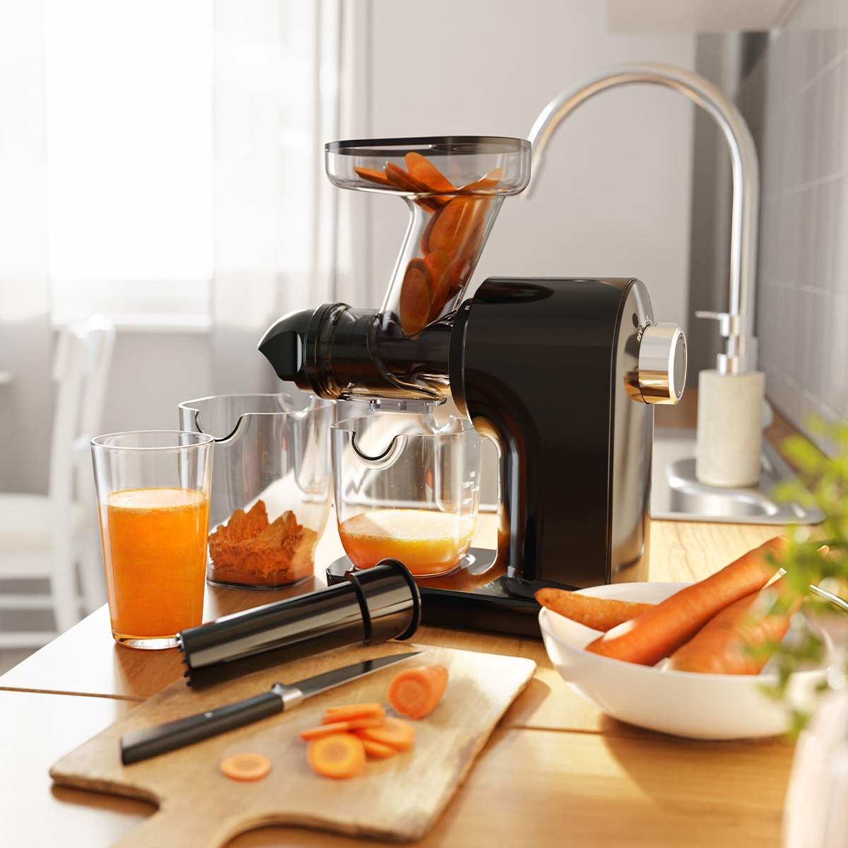 Black juicer with carrots and juice. Carrots in juicer and bowl. Kitchen setting.