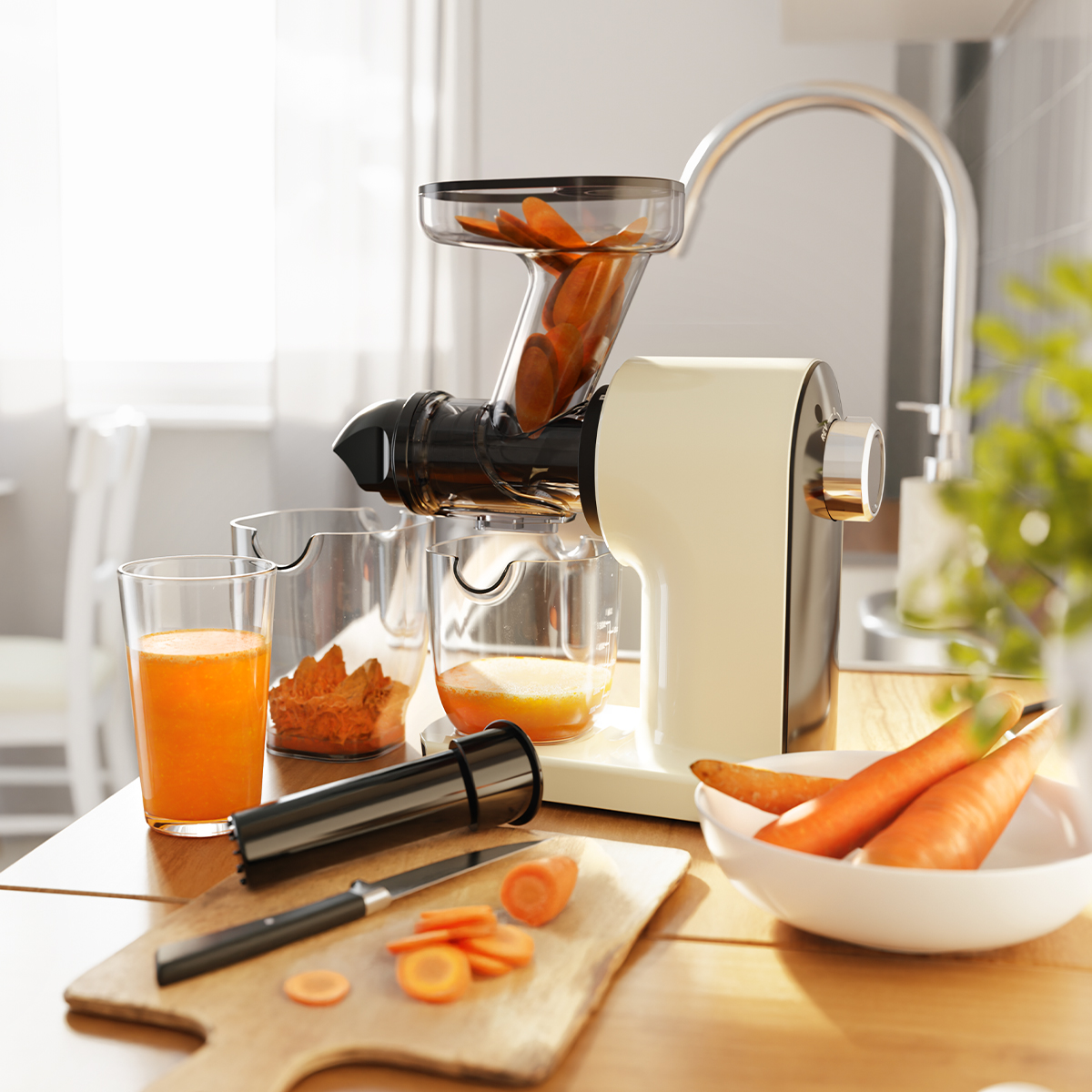 Cream juicer with carrots and juice. Carrots in juicer and bowl. Kitchen setting.