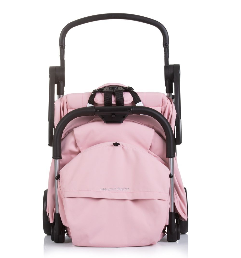 Zusammengeklappter rosa Kinderwagen mit schwarzem Rahmen. Griff und Text 'use your illusion'.