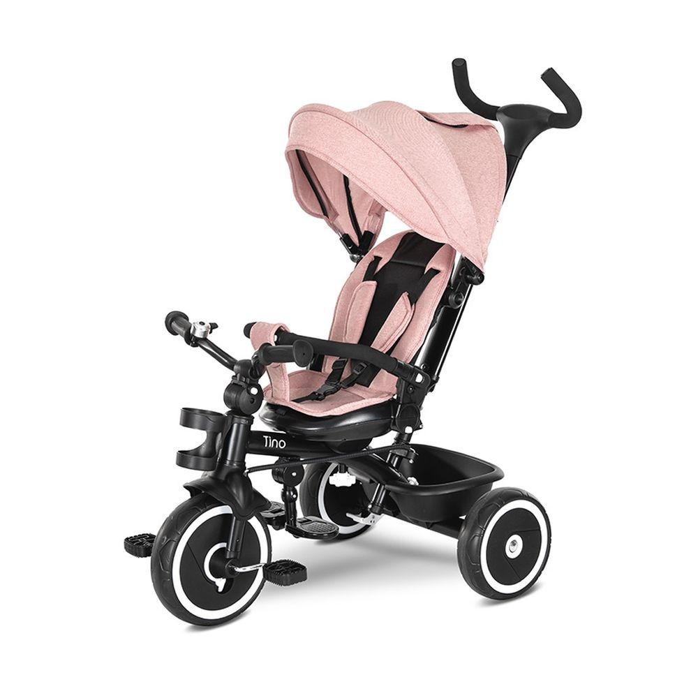 Rosa Baby-Dreirad mit schwarzen Details. Es hat ein Sonnensegel und einen Korb.