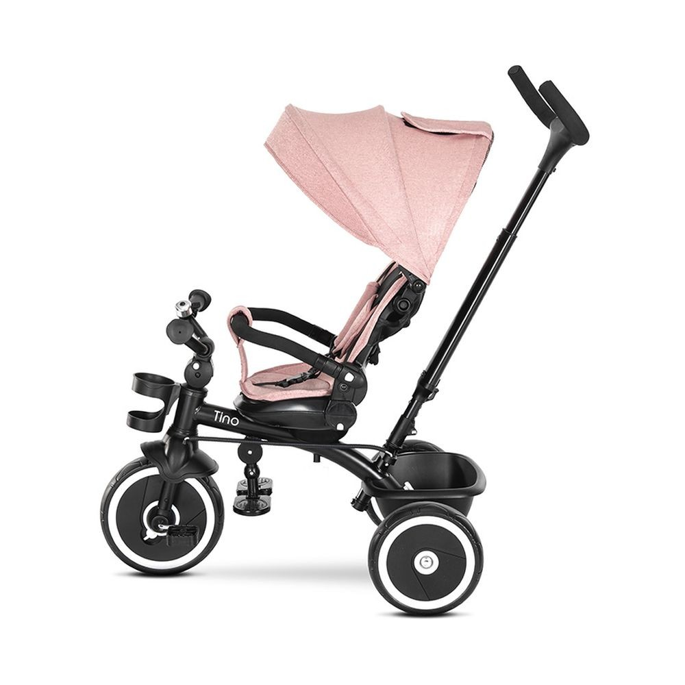 Ein rosa und schwarzes Tino-Dreirad. Es hat drei Räder, einen Sonnenschutz und einen Korb.