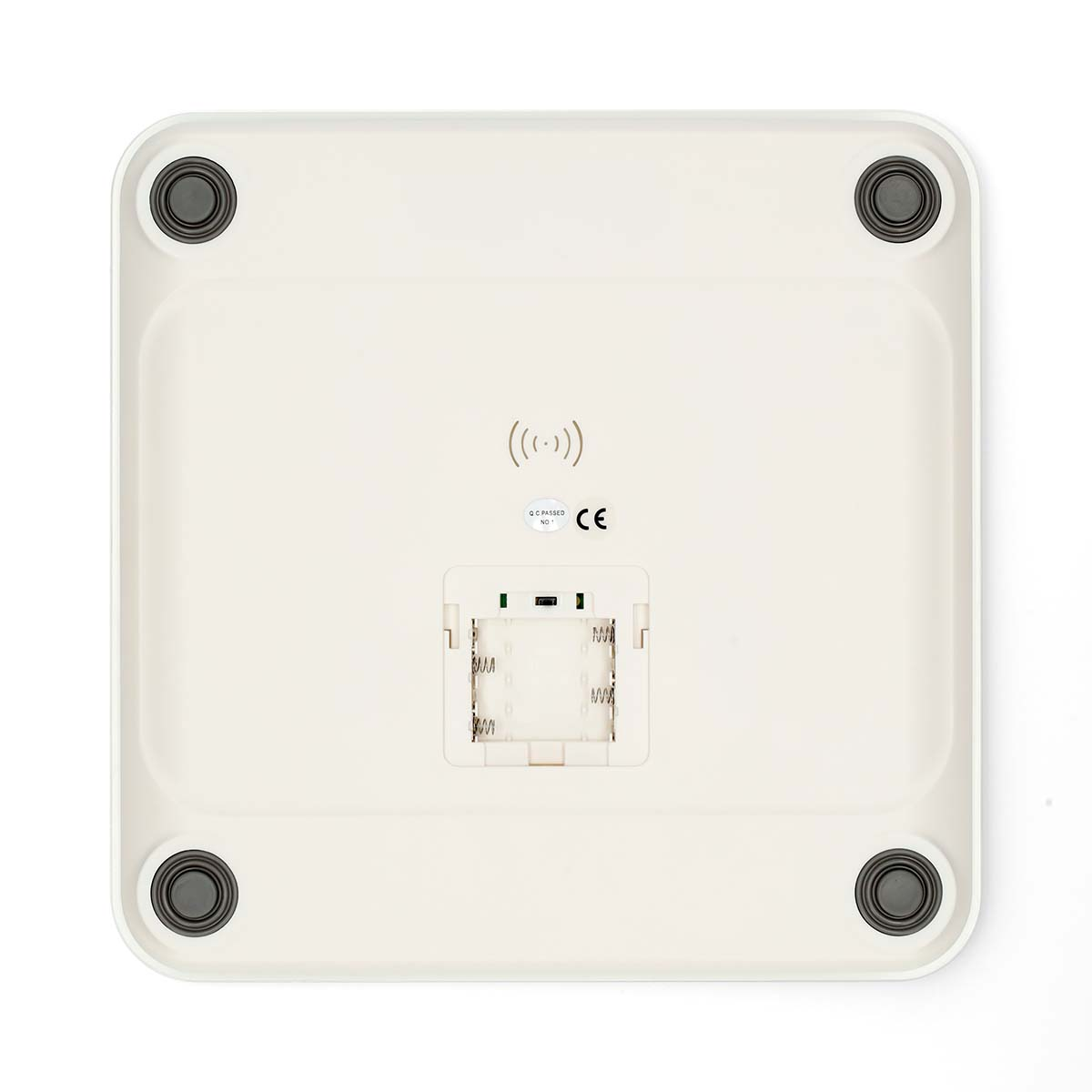 Biała waga, widok od spodu z komorą baterii i symbolem bezprzewodowym.