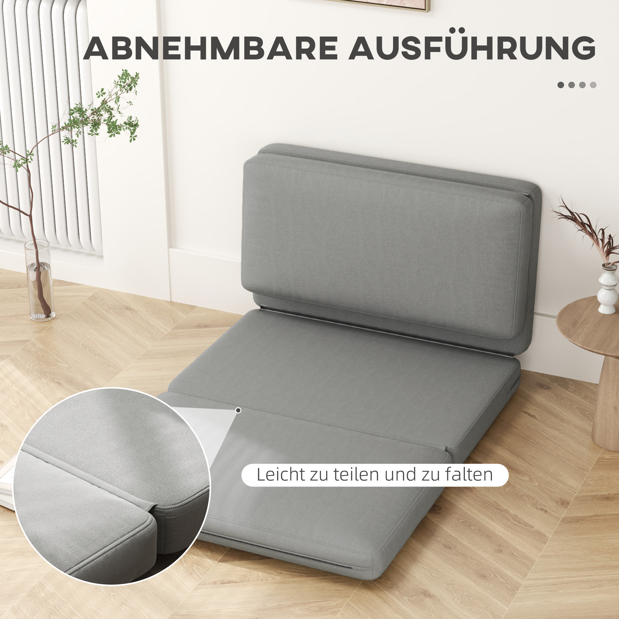 Ein grauer Sitz gefaltet und entfaltet.