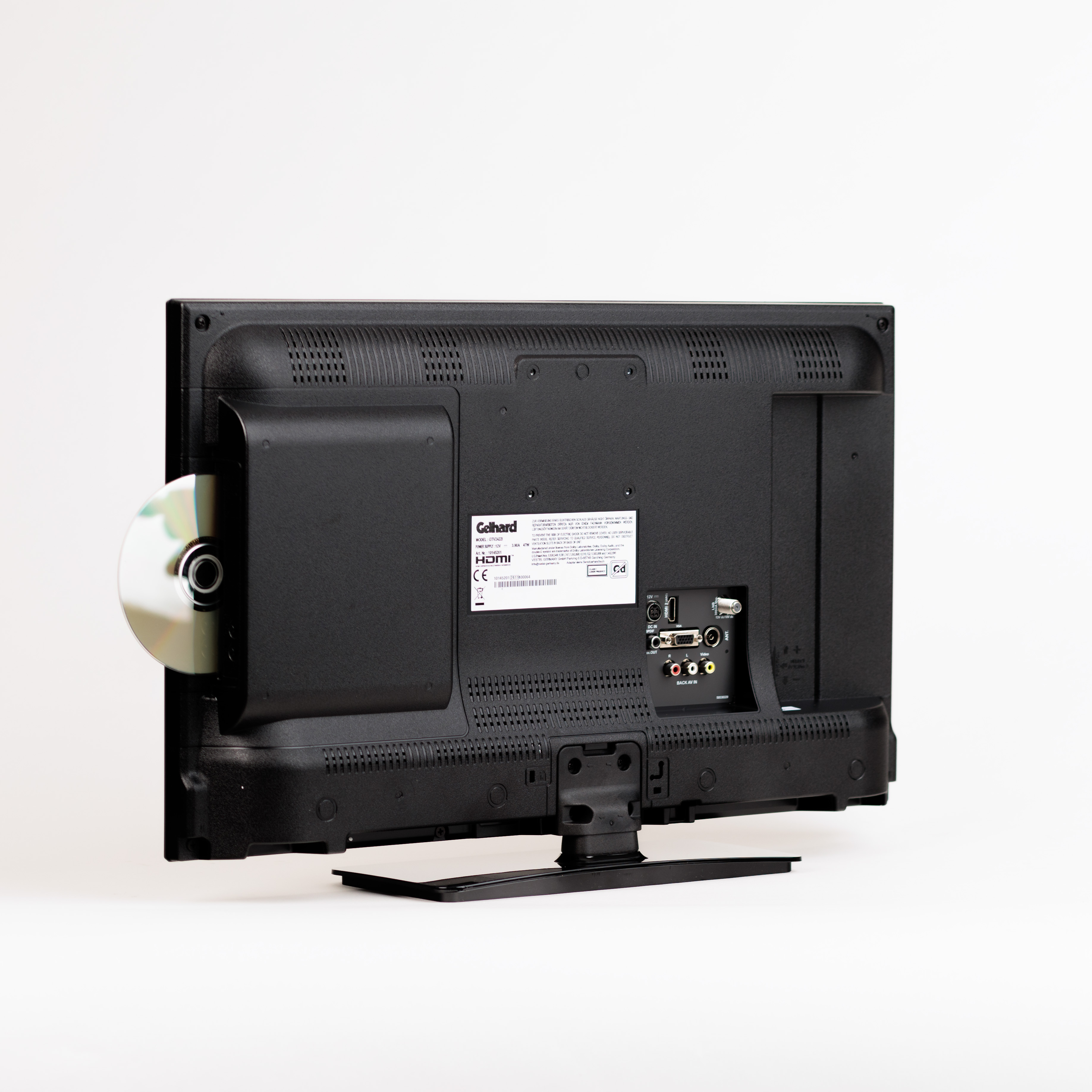Rückseite eines schwarzen Fernsehers mit DVD-Player, eine CD ist teilweise eingesetzt.