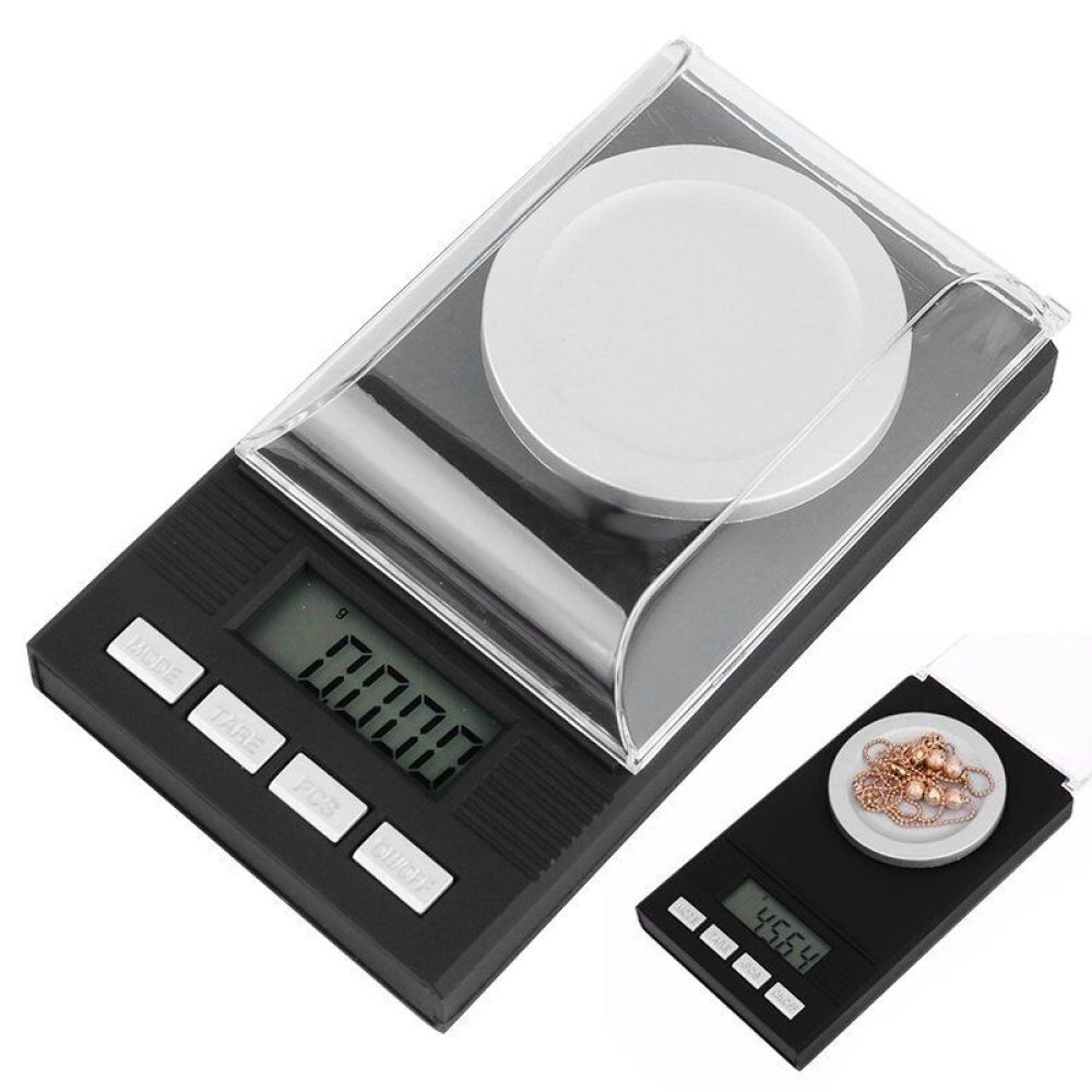 Digitale Waage mit klarer Abdeckung, Anzeige 0.000 und Tasten. Kleine Waage mit Schmuck.