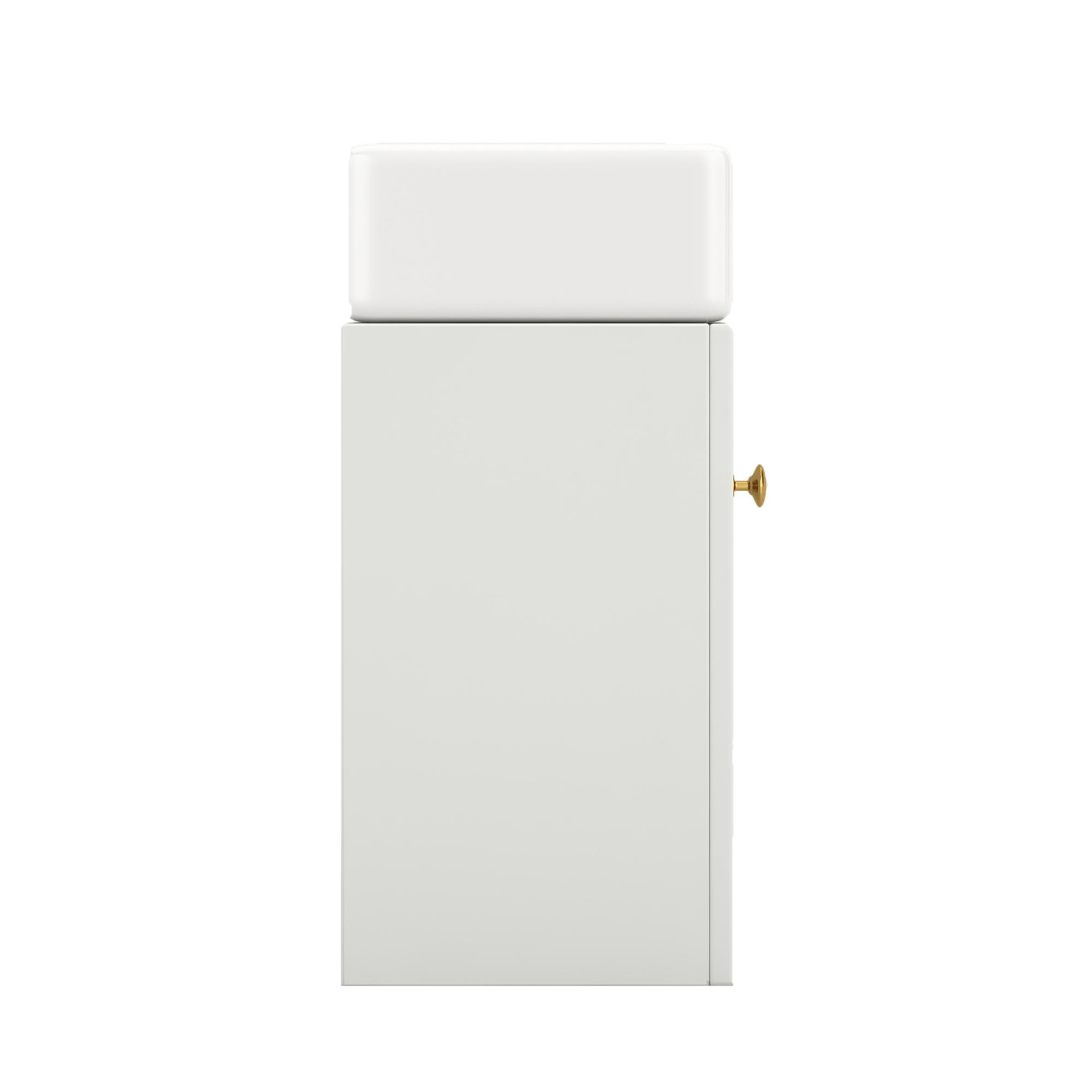 Seitenansicht eines weißen Badezimmer-Waschtischs mit rechteckigem Waschbecken und goldenem Knopf.
