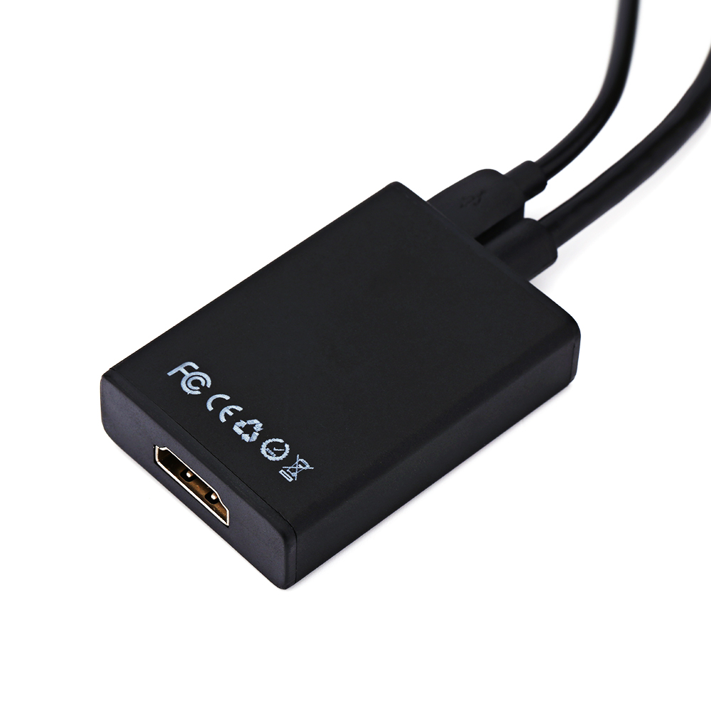 Ein schwarzer Adapter mit HDMI- und USB-Anschlüssen.