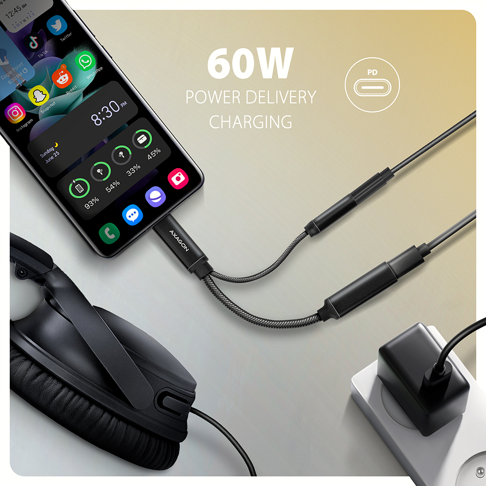 Smartphone en charge avec un adaptateur de câble, avec des icônes pour diverses applications et une alimentation de 60W.