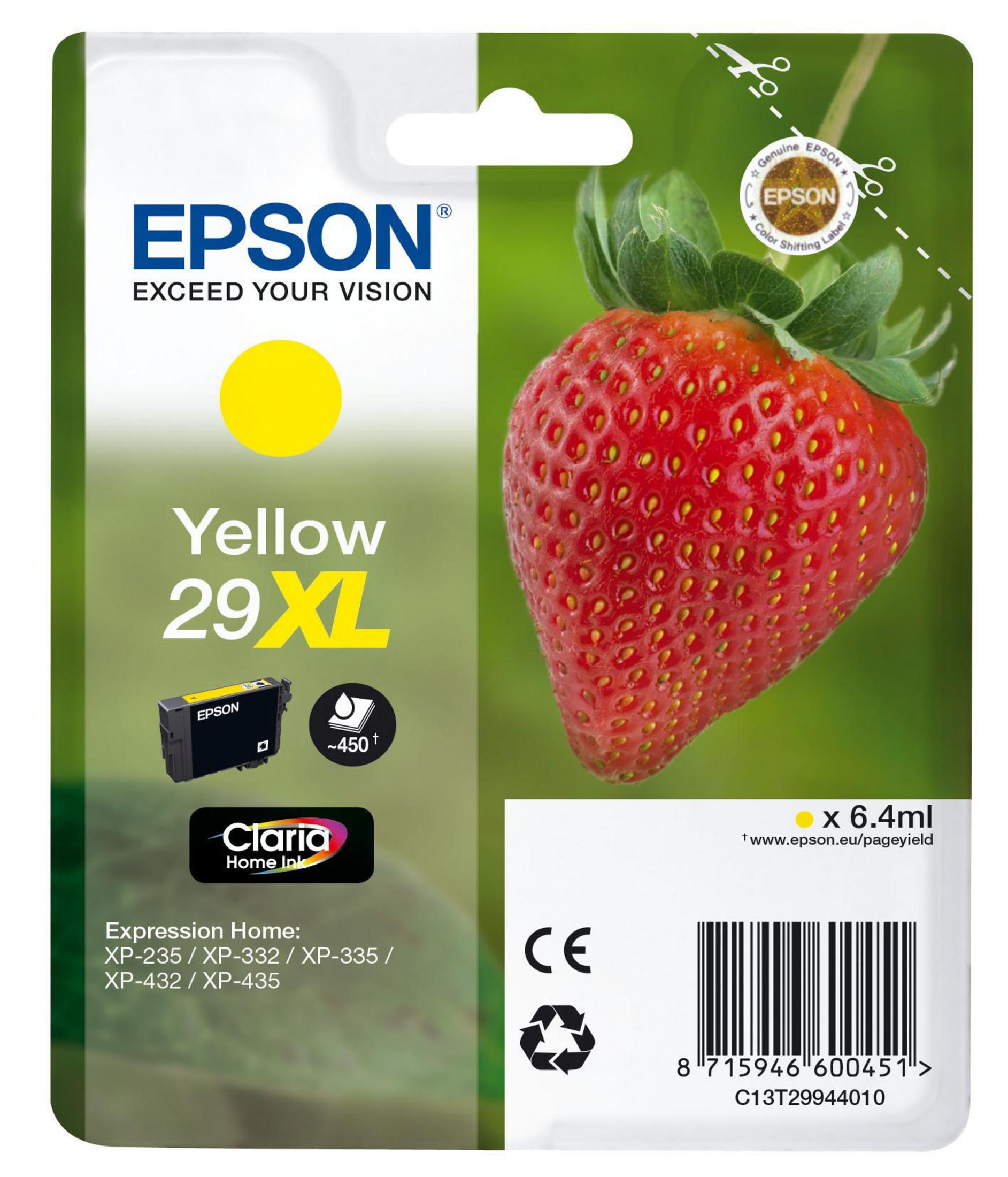Ein grauer Canon-Tintenbehälter mit einer rot-weißen Verpackung im Hintergrund.