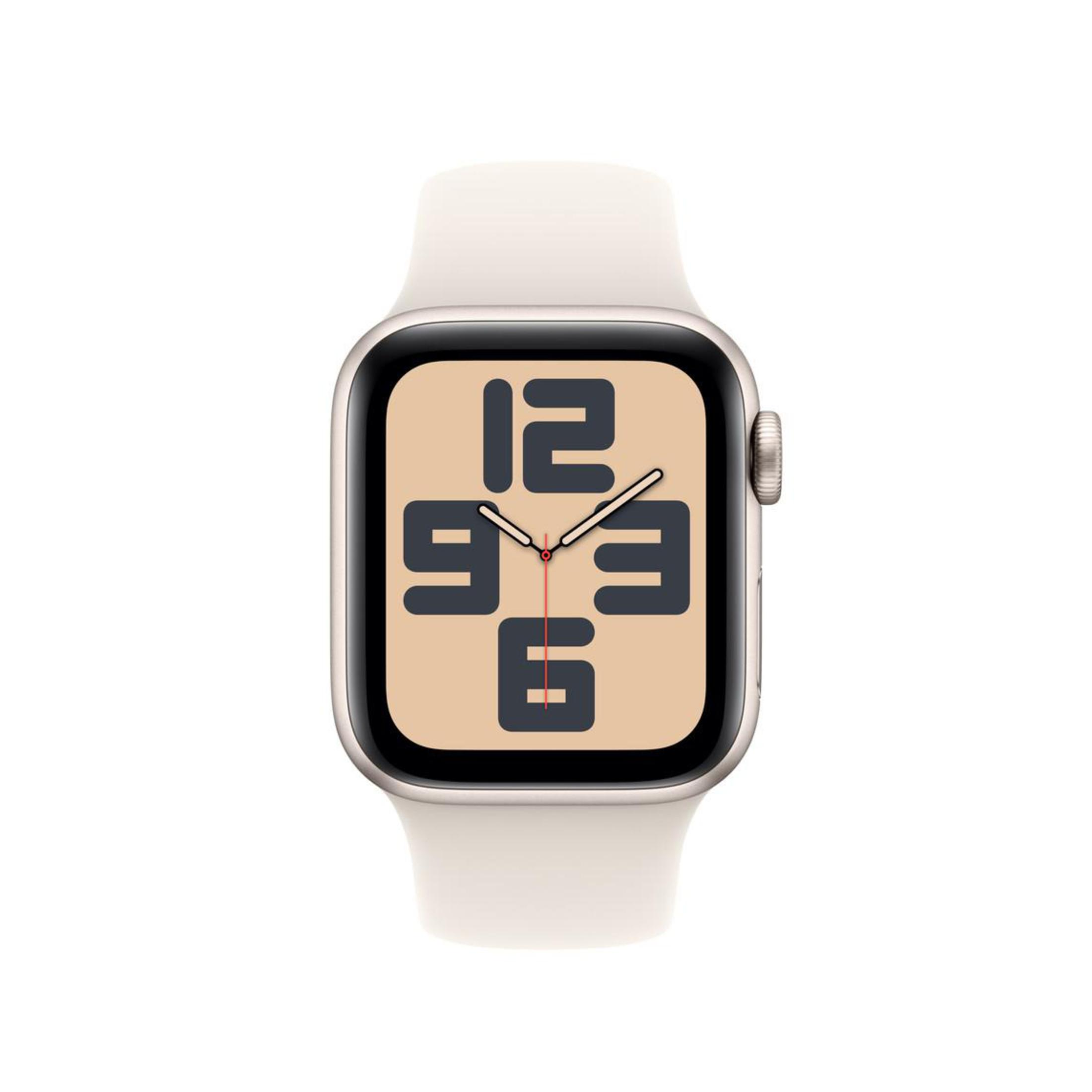 Apple Watch z kremowym paskiem. Tarcza jest beżowa z czarnymi cyframi. Godzina to 9:36.