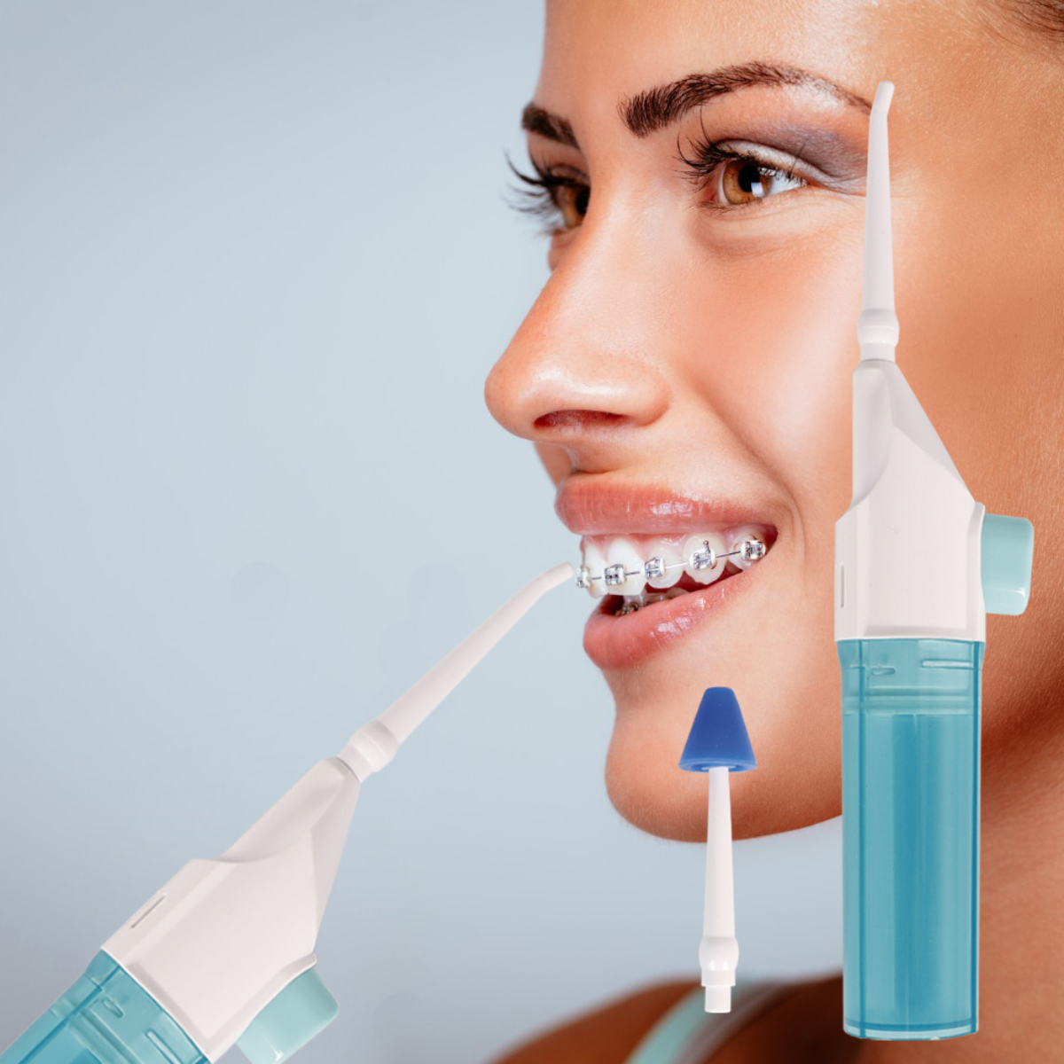 Mujer sonriendo, usando irrigador oral con brackets. Dos irrigadores, uno con tanque azul.