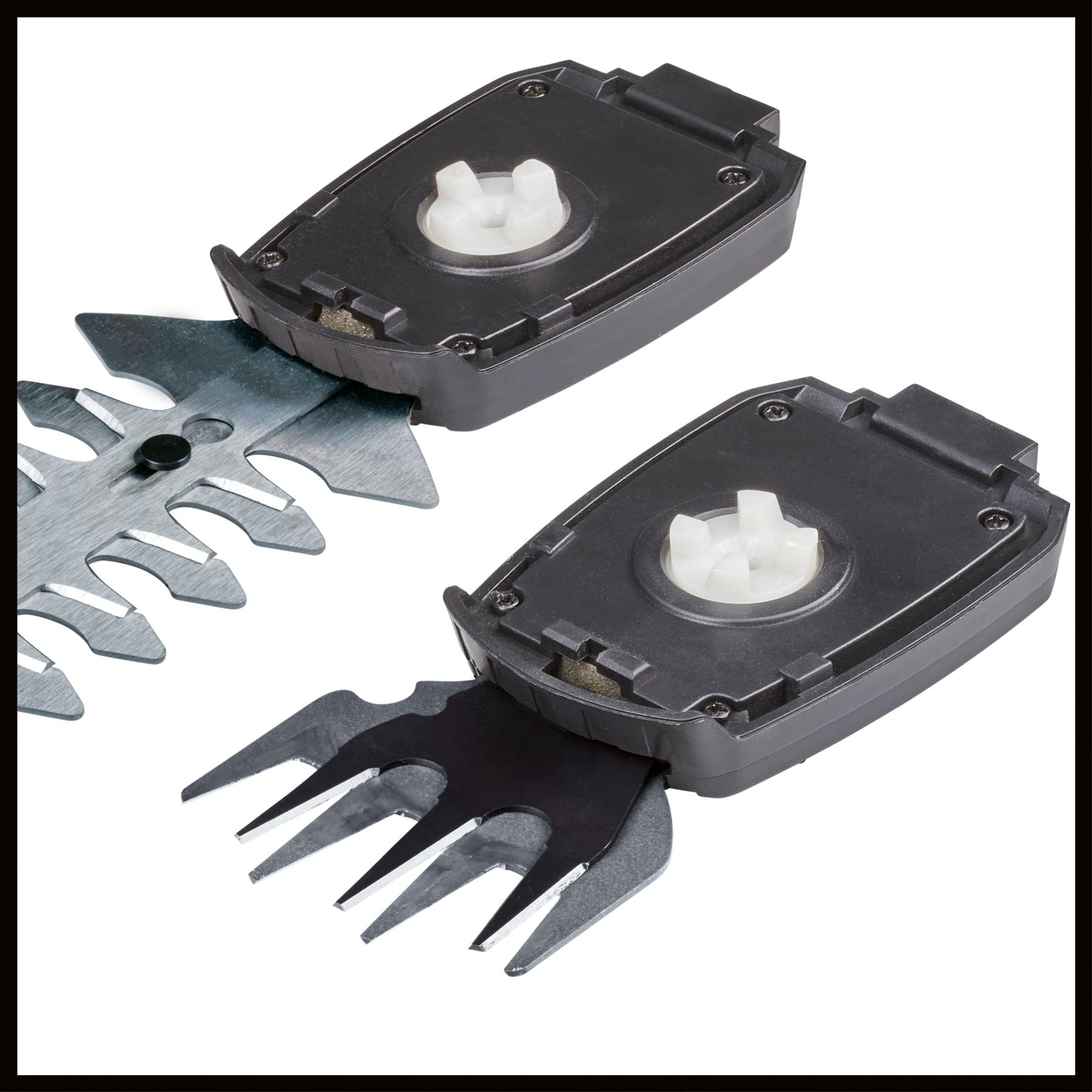 Zbliżenie ostrza nożyc do żywopłotu z czarną obudową silnika.