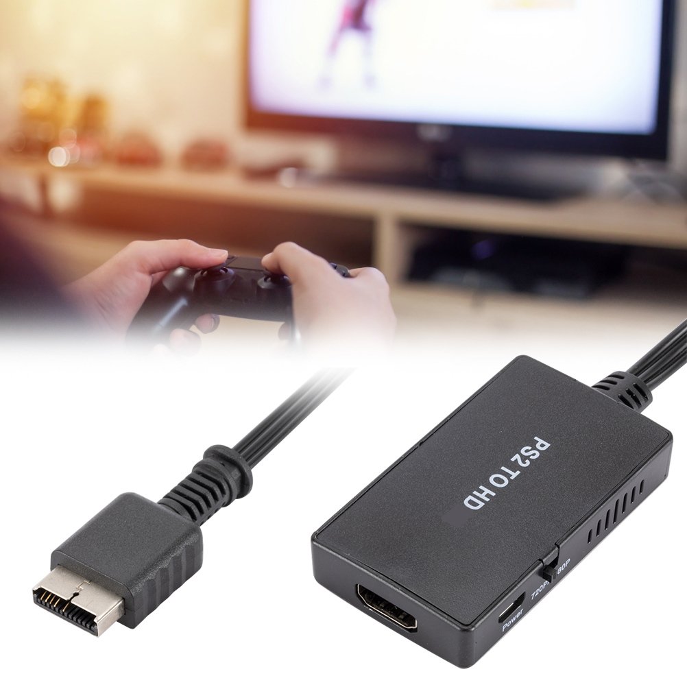 Person spielt Videospiel mit Controller. Schwarzer PS2-zu-HDMI-Adapter.