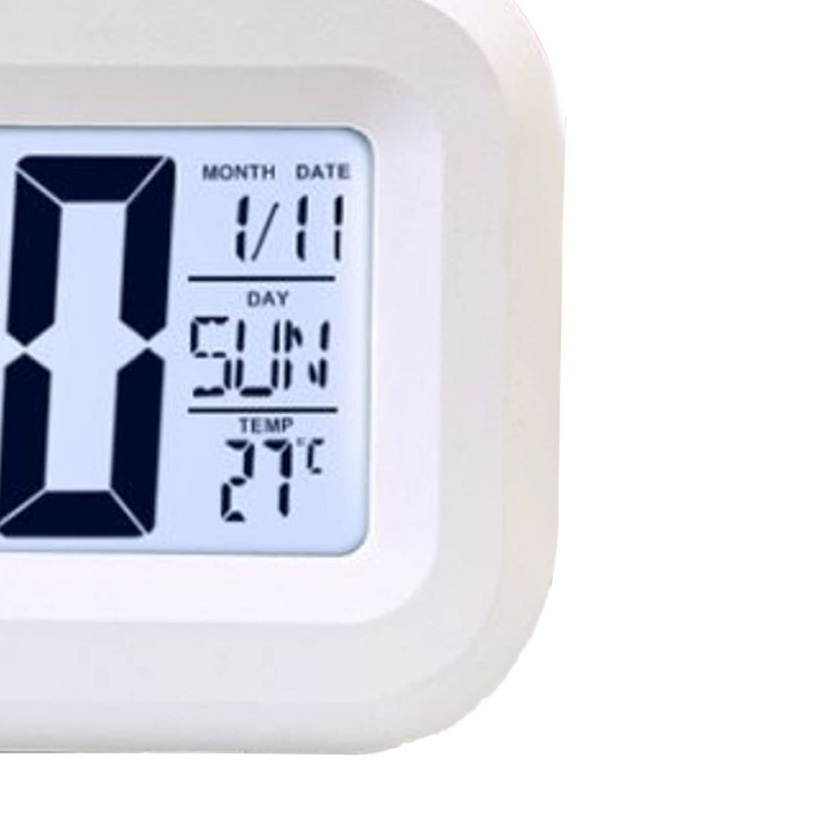 Nahaufnahme einer weißen Digitaluhr, die Datum, Tag und Temperatur anzeigt. Die Uhr hat ein schlichtes Design.
