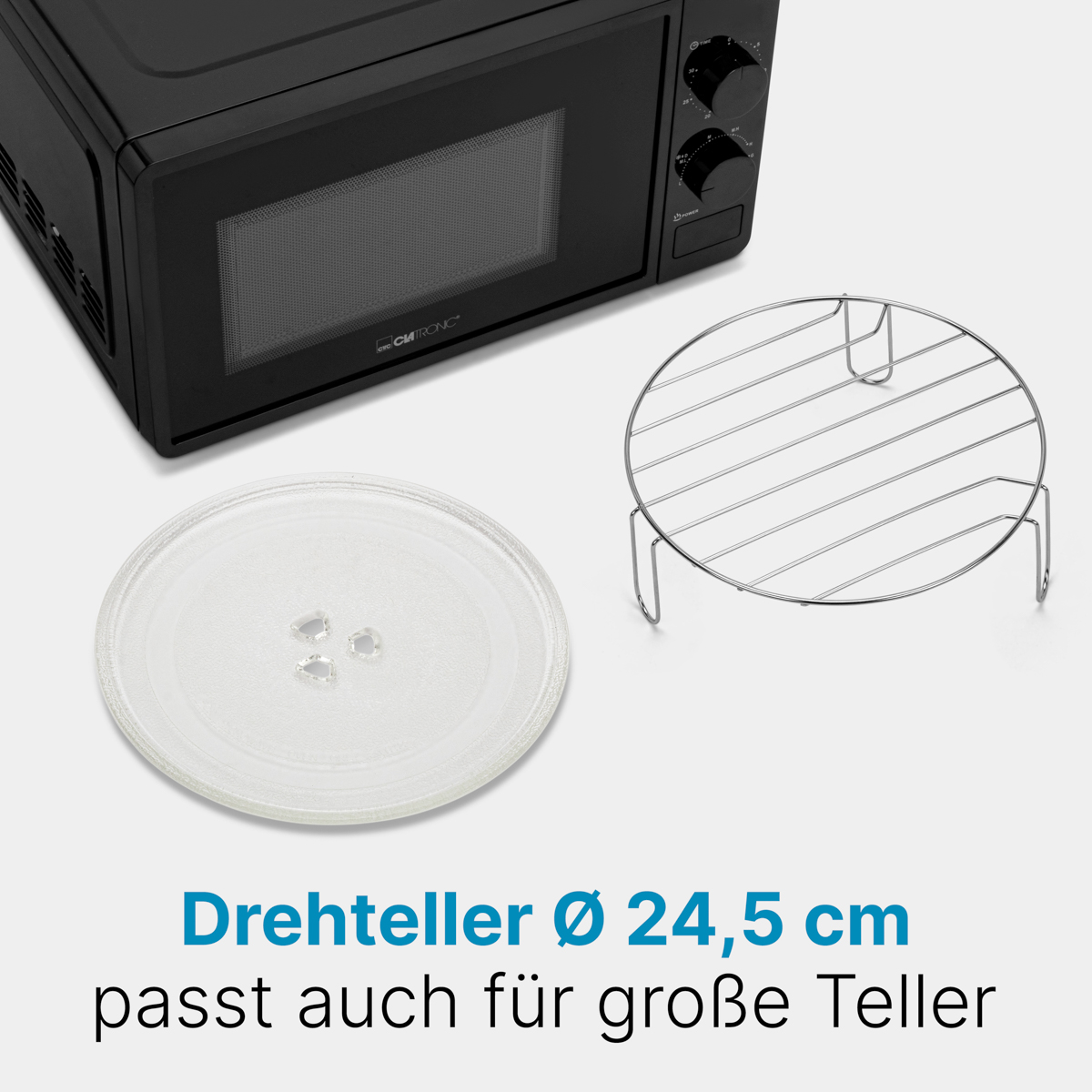 Czarna kuchenka mikrofalowa ze szklanym talerzem i metalowym rusztem. Talerz i ruszt są na blacie.