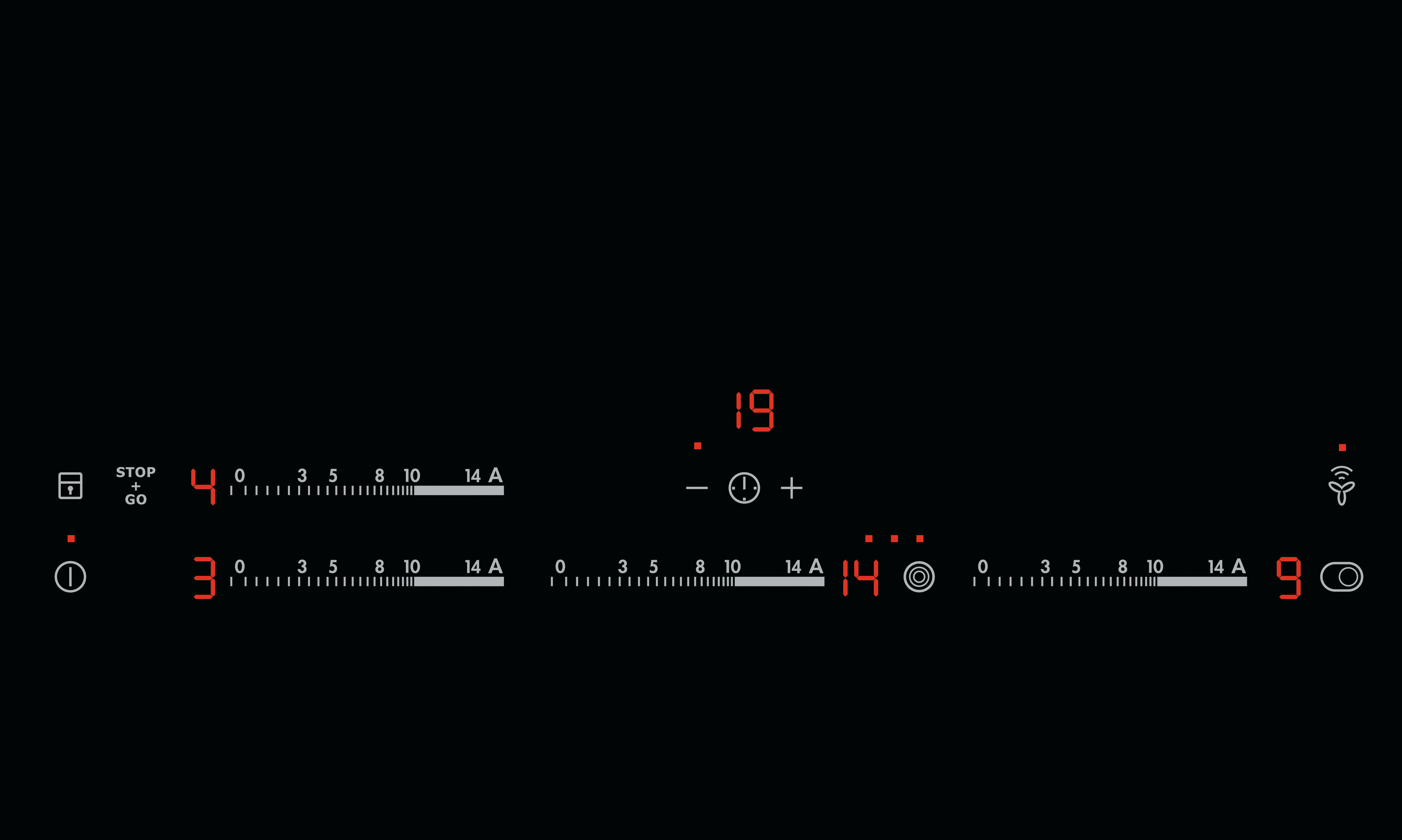 Un elemento riscaldante rosso circolare su un piano cottura nero. Sono visibili cerchi concentrici.