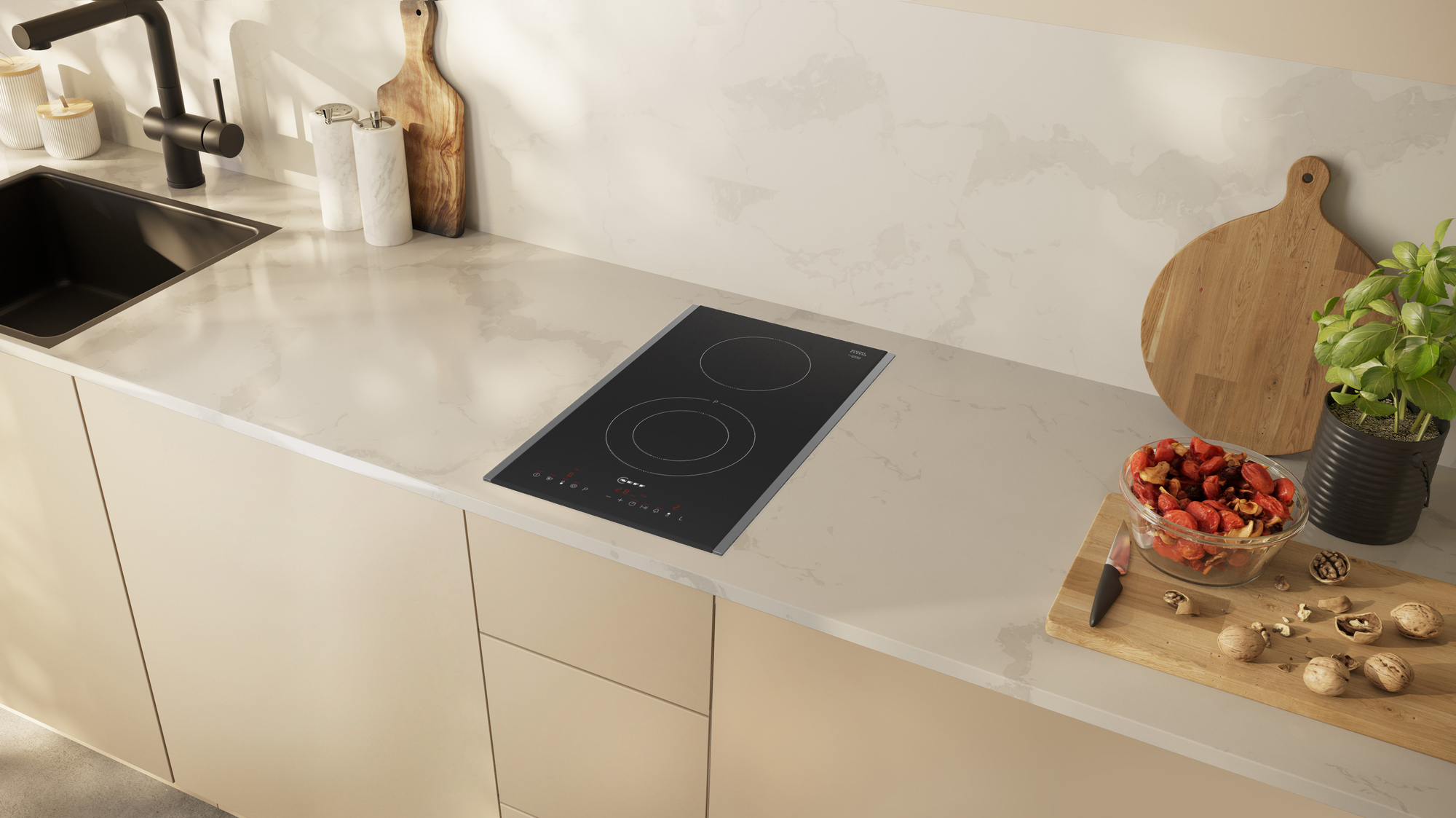 Cucina moderna con piano cottura a induzione nero su un piano di lavoro bianco.