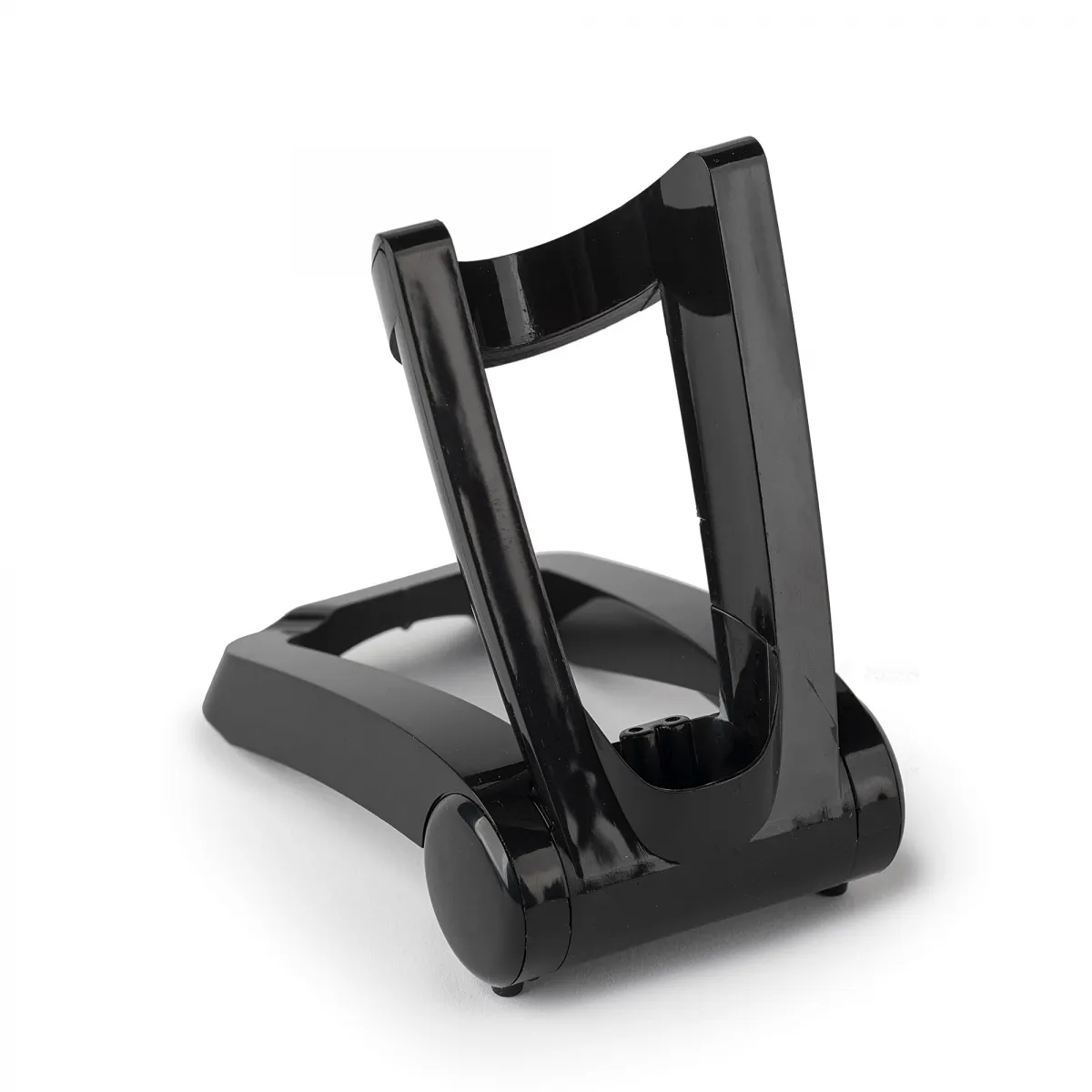 Czarny, plastikowy stojak na golarkę elektryczną, widok z niskiego kąta.