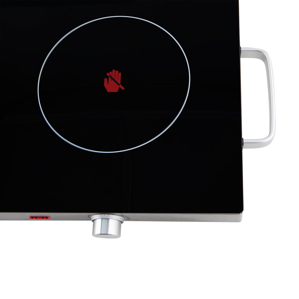 Czarna płyta elektryczna z jedną strefą gotowania. Czerwona ikona dłoni pośrodku.