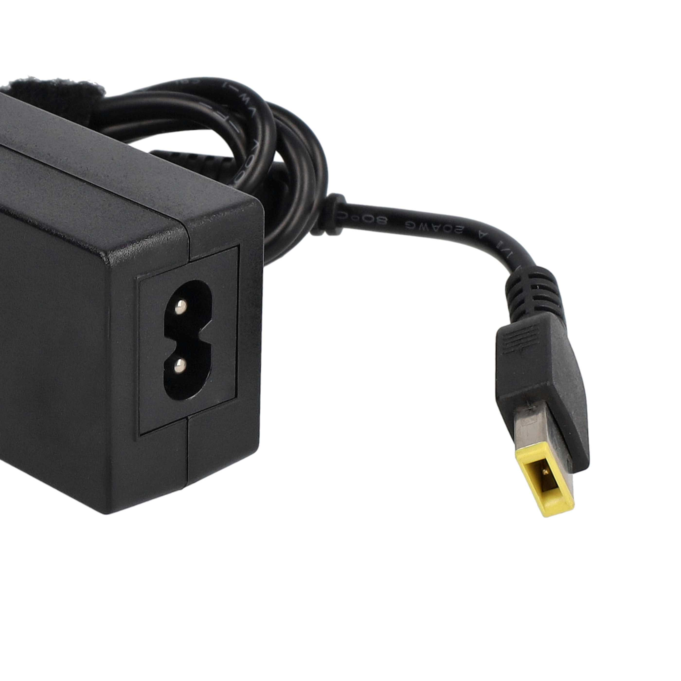 Nahaufnahme eines Laptop-Ladegeräts mit schwarzem Stecker und einem gelbspitzigen USB-Stecker.