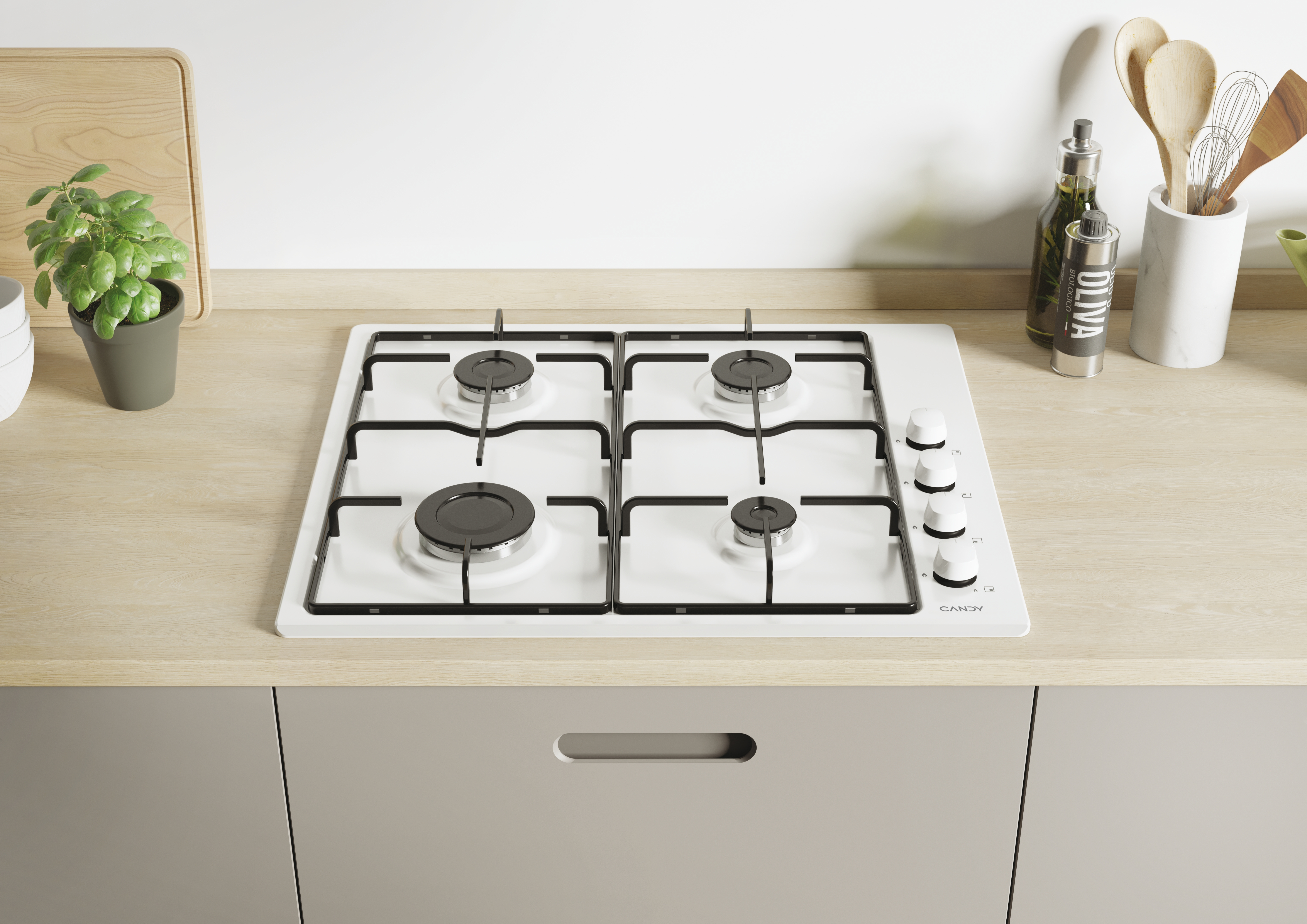 Biała kuchenka gazowa z czterema palnikami, białą powierzchnią i pokrętłami, na drewnianym blacie.