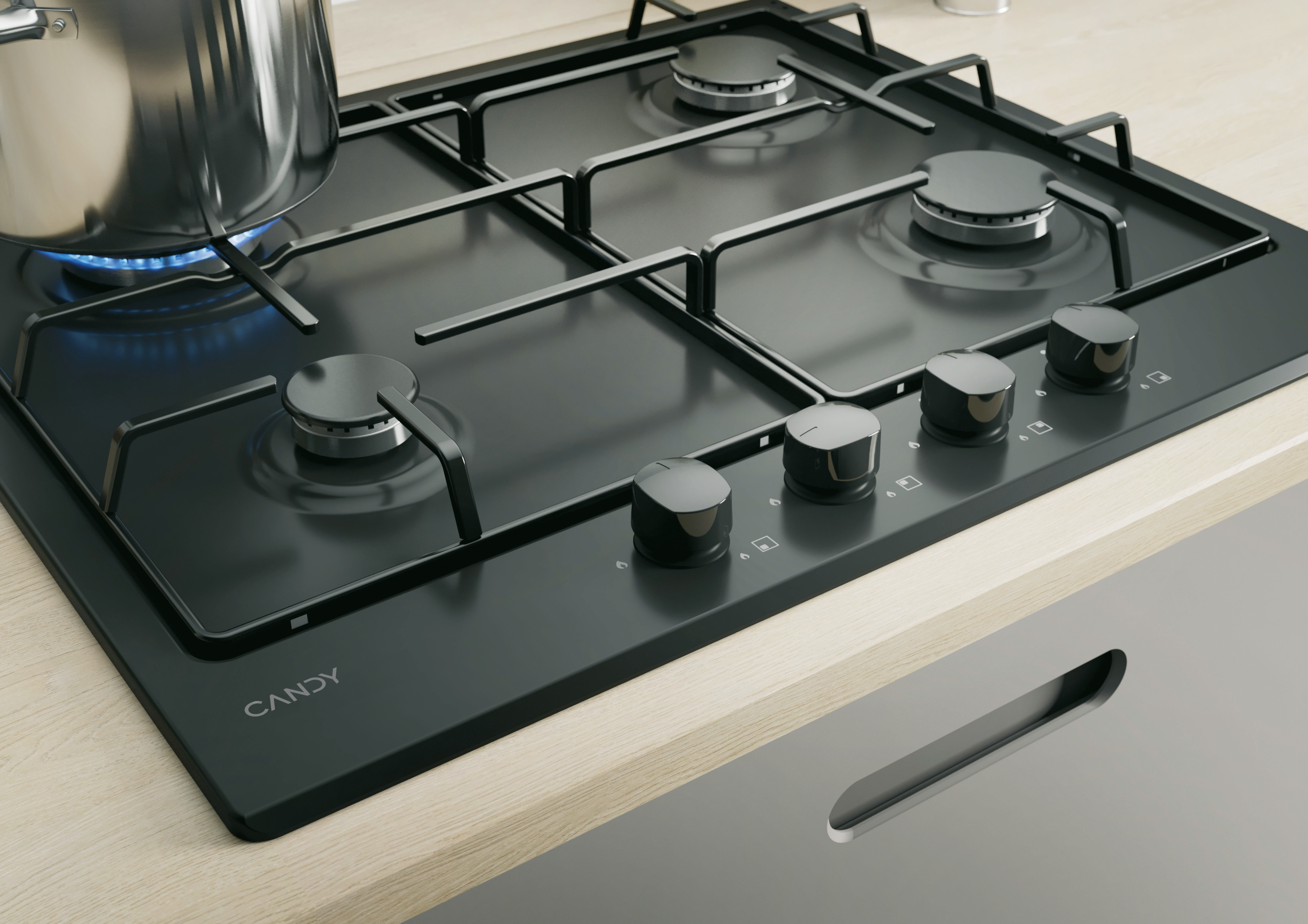 Czarna gazowa płyta grzewcza z 4 palnikami, pokrętłami i garnkiem na blacie.