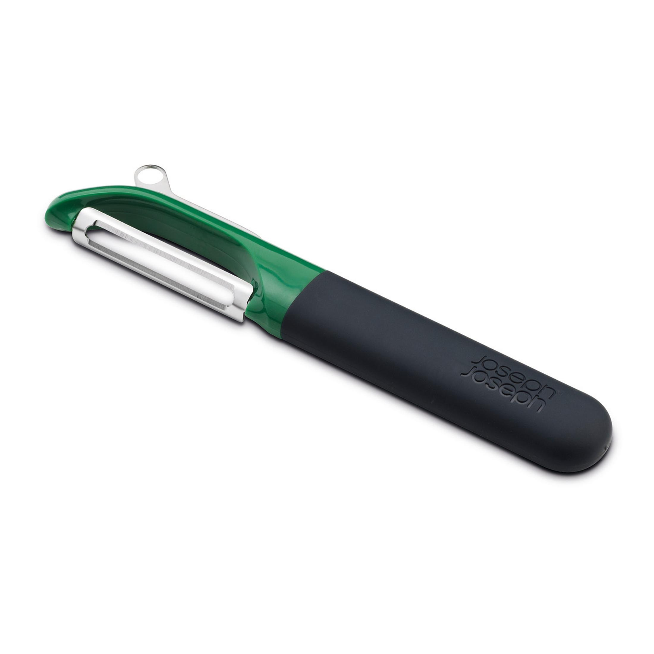 Green and black vegetable peeler on white background. The handle has the words 'joseph joseph'.