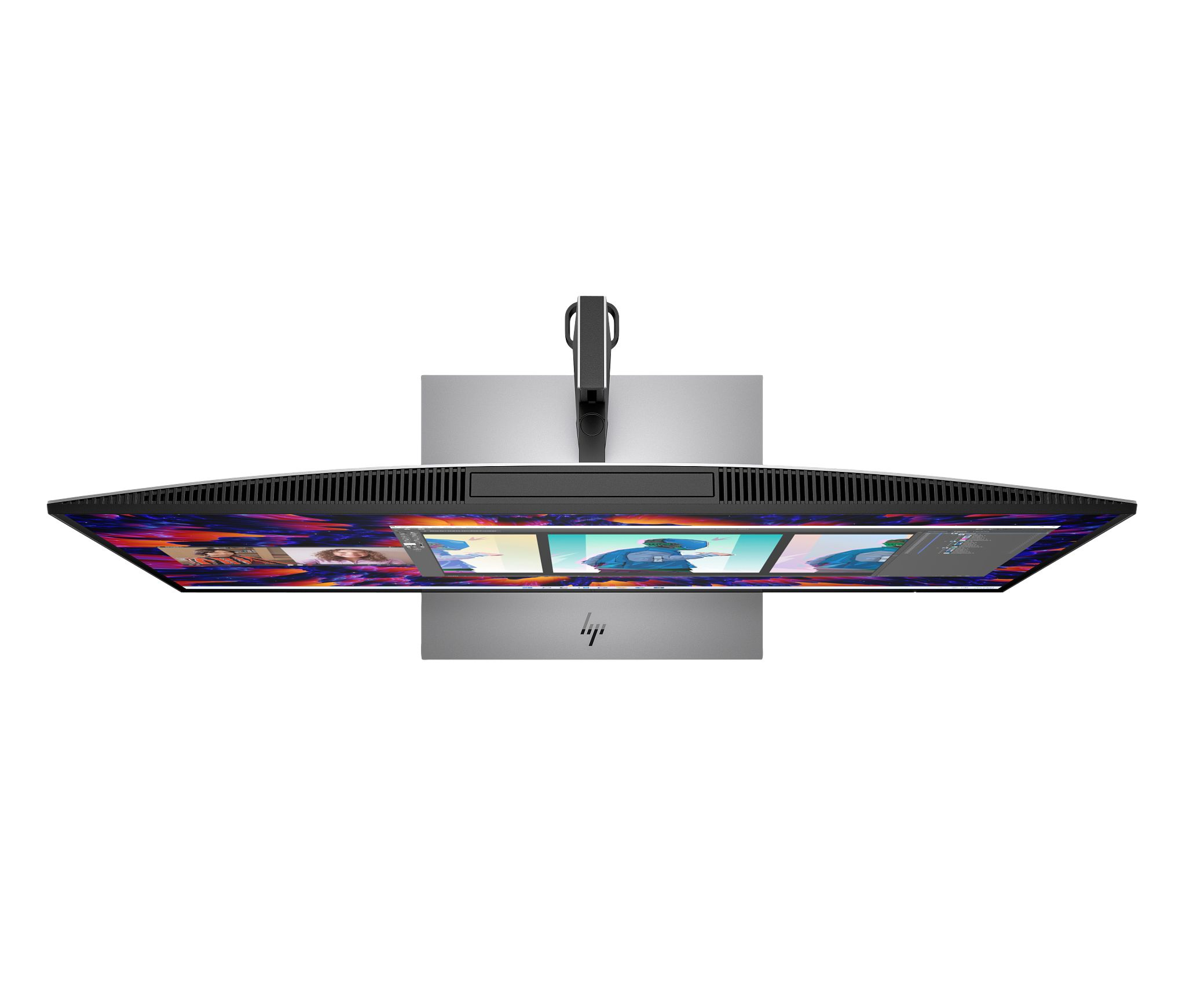 An overhead view of an HP monitor. The screen displays a design software interface.