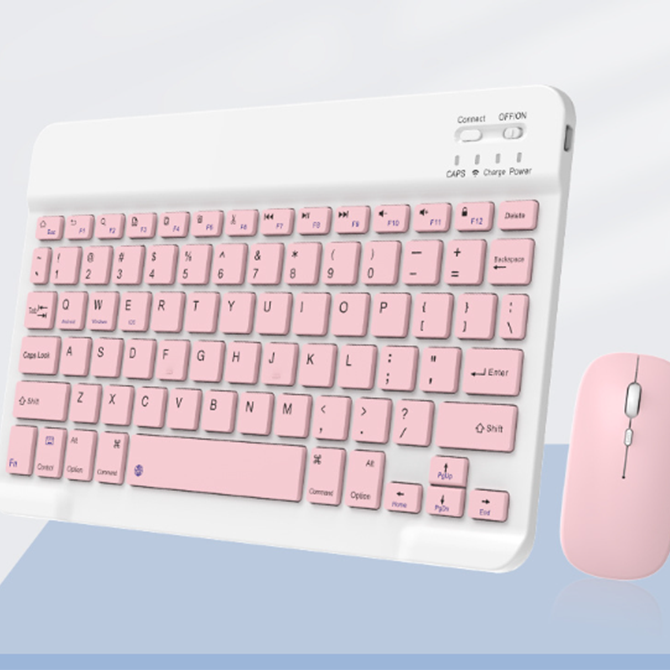 Weiße Tastatur mit rosa Tasten und eine rosa Maus. Hat Verbindungs- und Einschaltknöpfe.