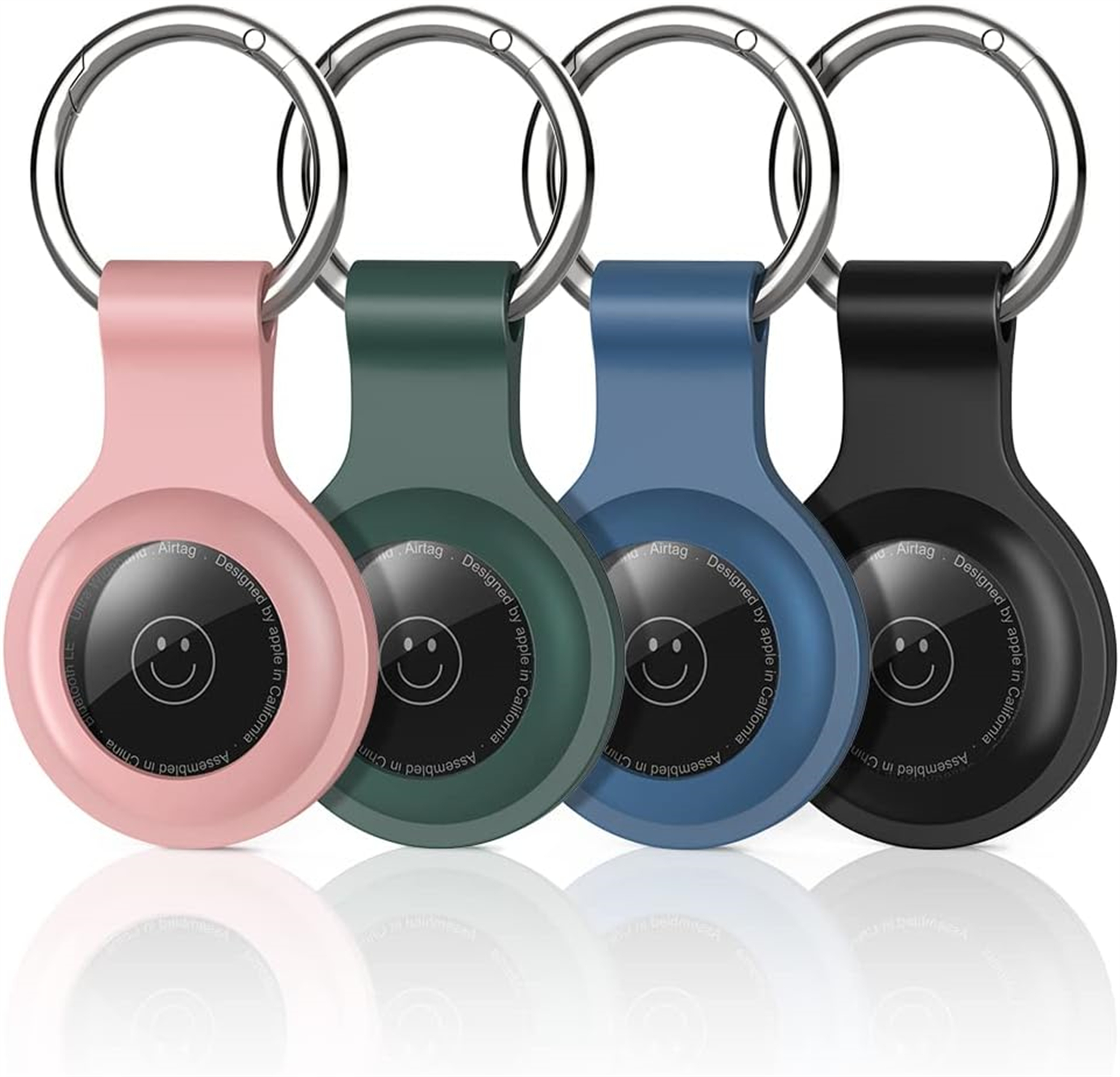 Vier farbige AirTag-Schlüsselanhänger: rosa, grün, blau und schwarz. Jeder mit einem Silberring.