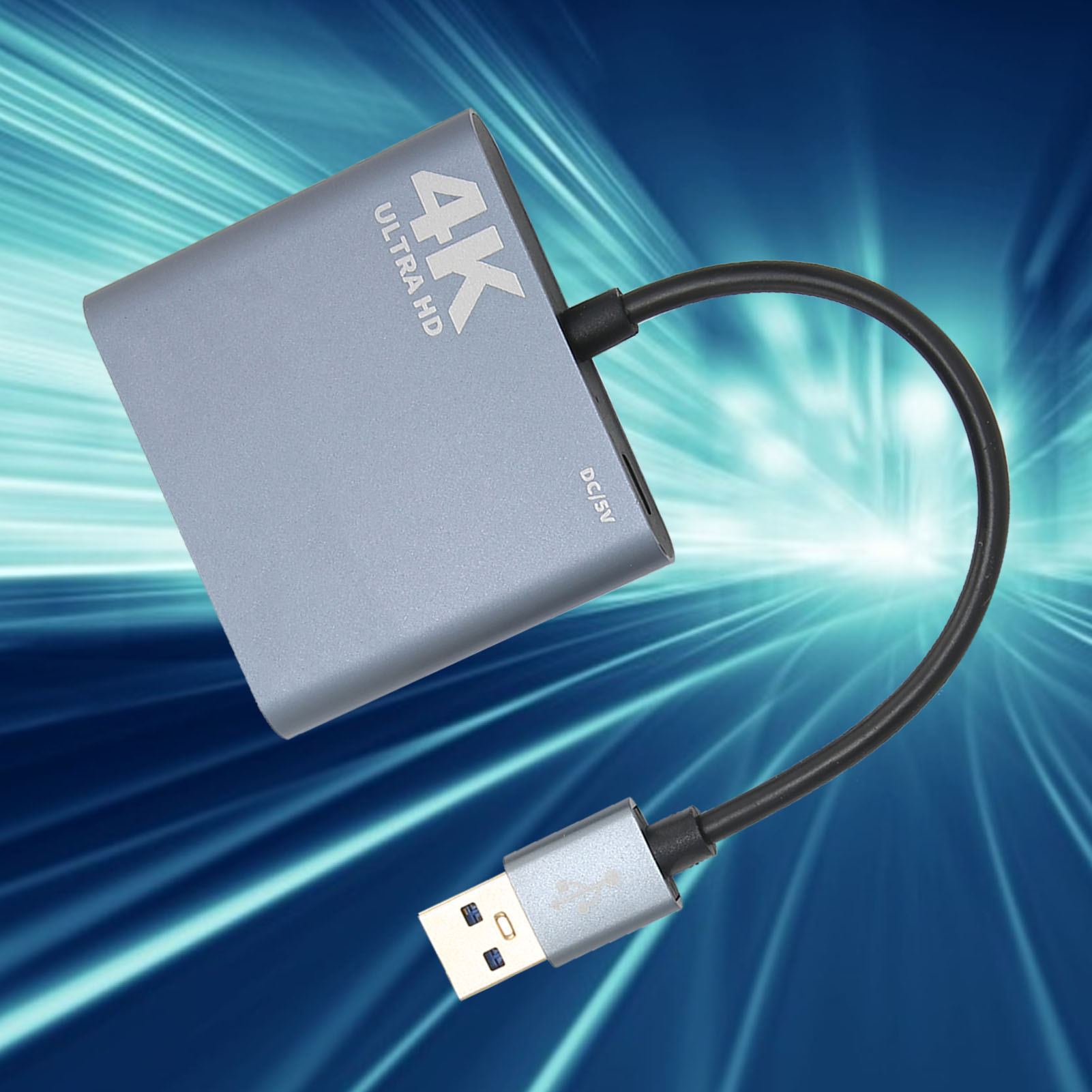 Ein grauer 4K Ultra HD-Adapter mit einem USB-Anschluss und einem schwarzen Kabel.