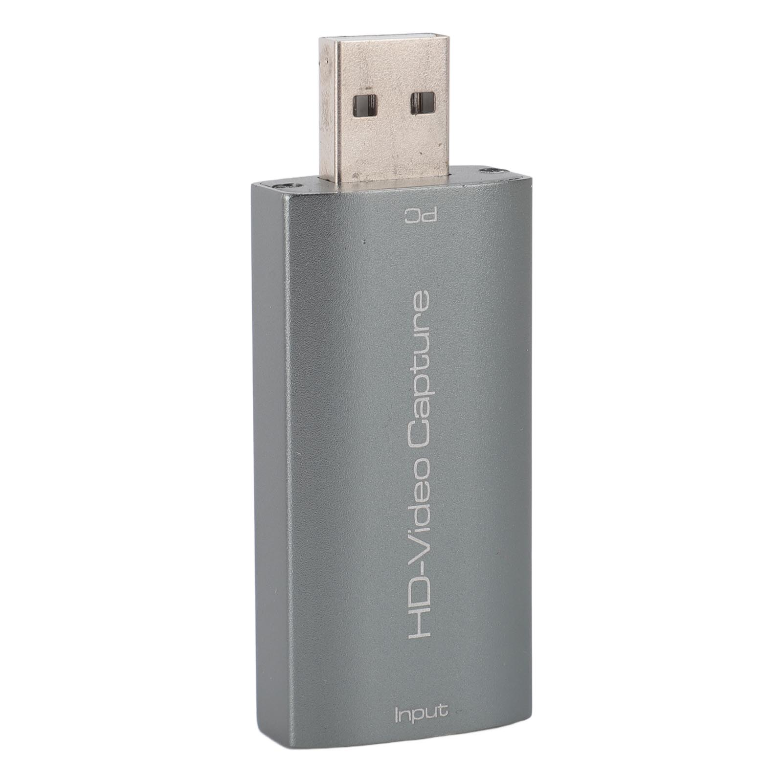 Silbernes Videoaufnahmegerät mit USB-Anschluss, beschriftet mit 'HD-Video Capture' und 'Input'.