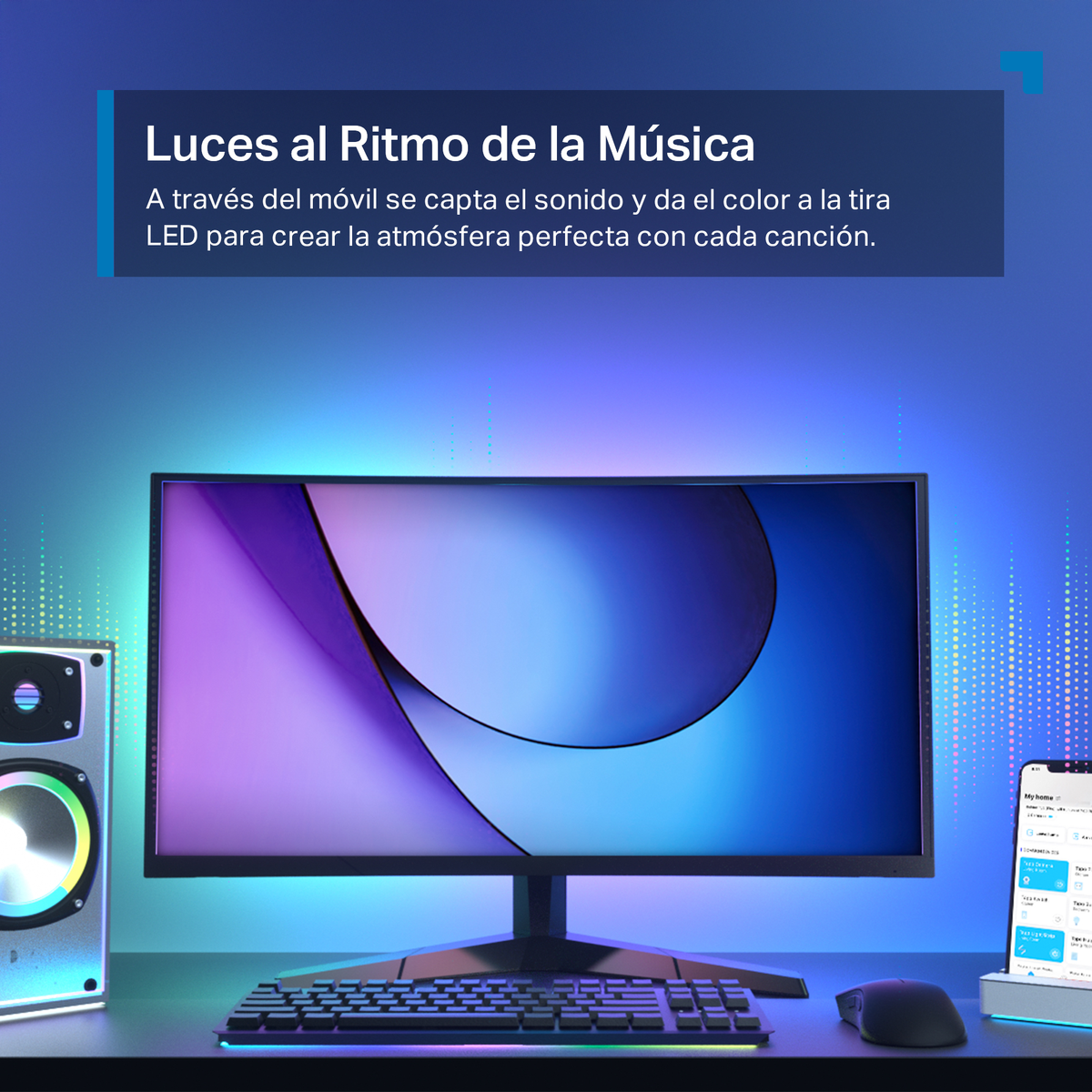 Moniteur avec lumières colorées et téléphone. Haut-parleur à gauche. Souris et clavier visibles.