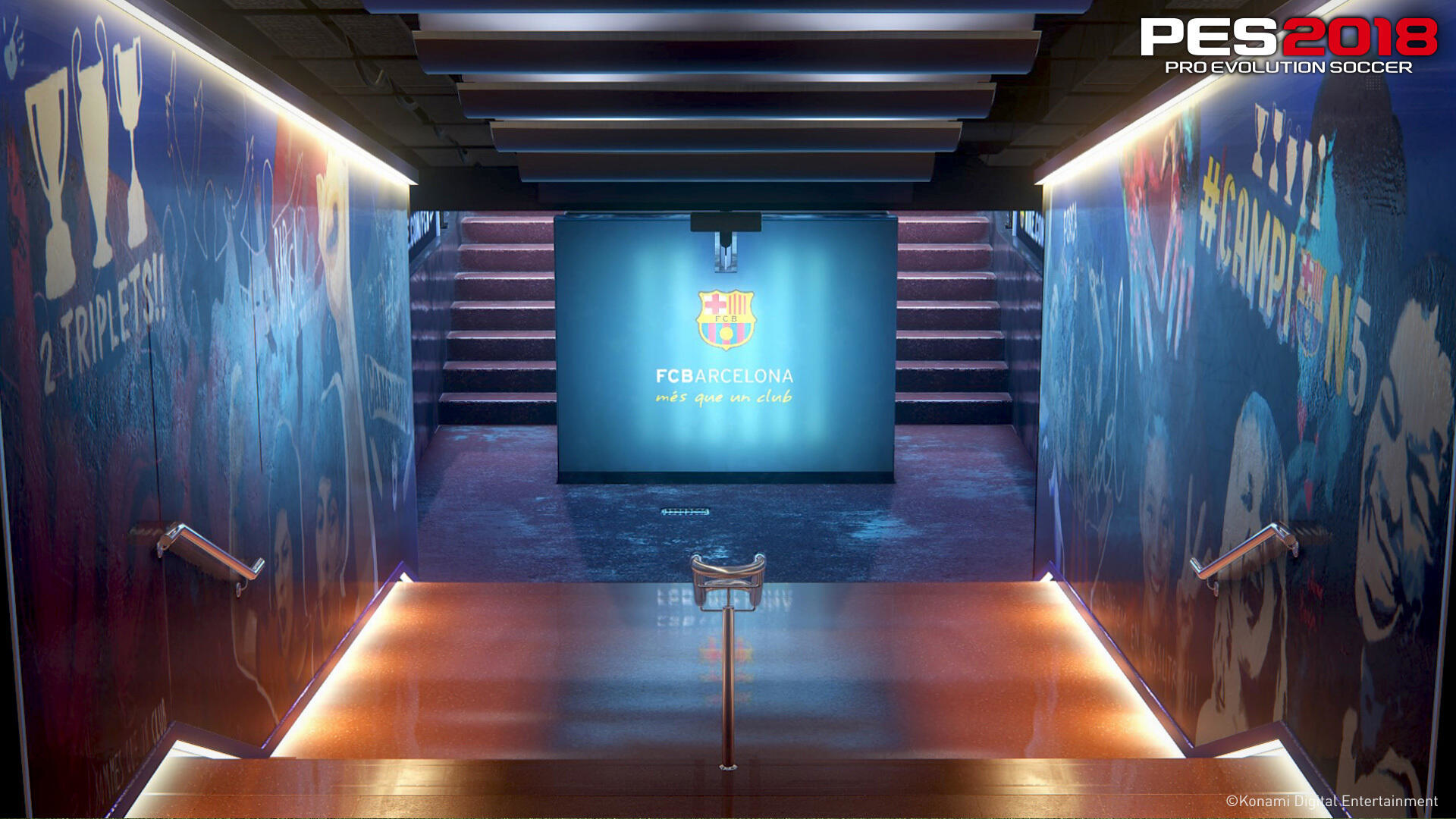 Tunel z logo 'FC BARCELONA' i schodami. Ściany wyświetlają obrazy i tekst.