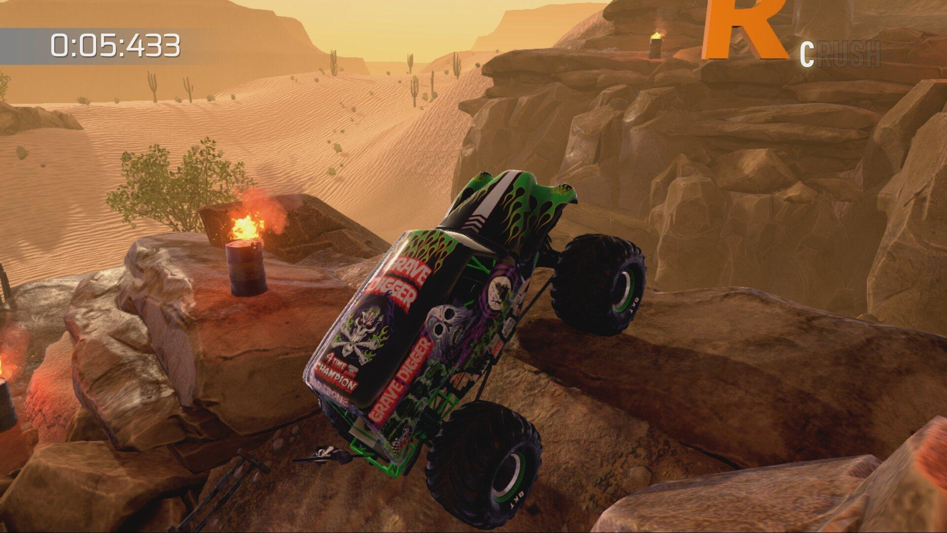 Ein Monstertruck mit Flammen springt über Felsen in einer Wüstenumgebung. Die Spieloberfläche ist sichtbar.