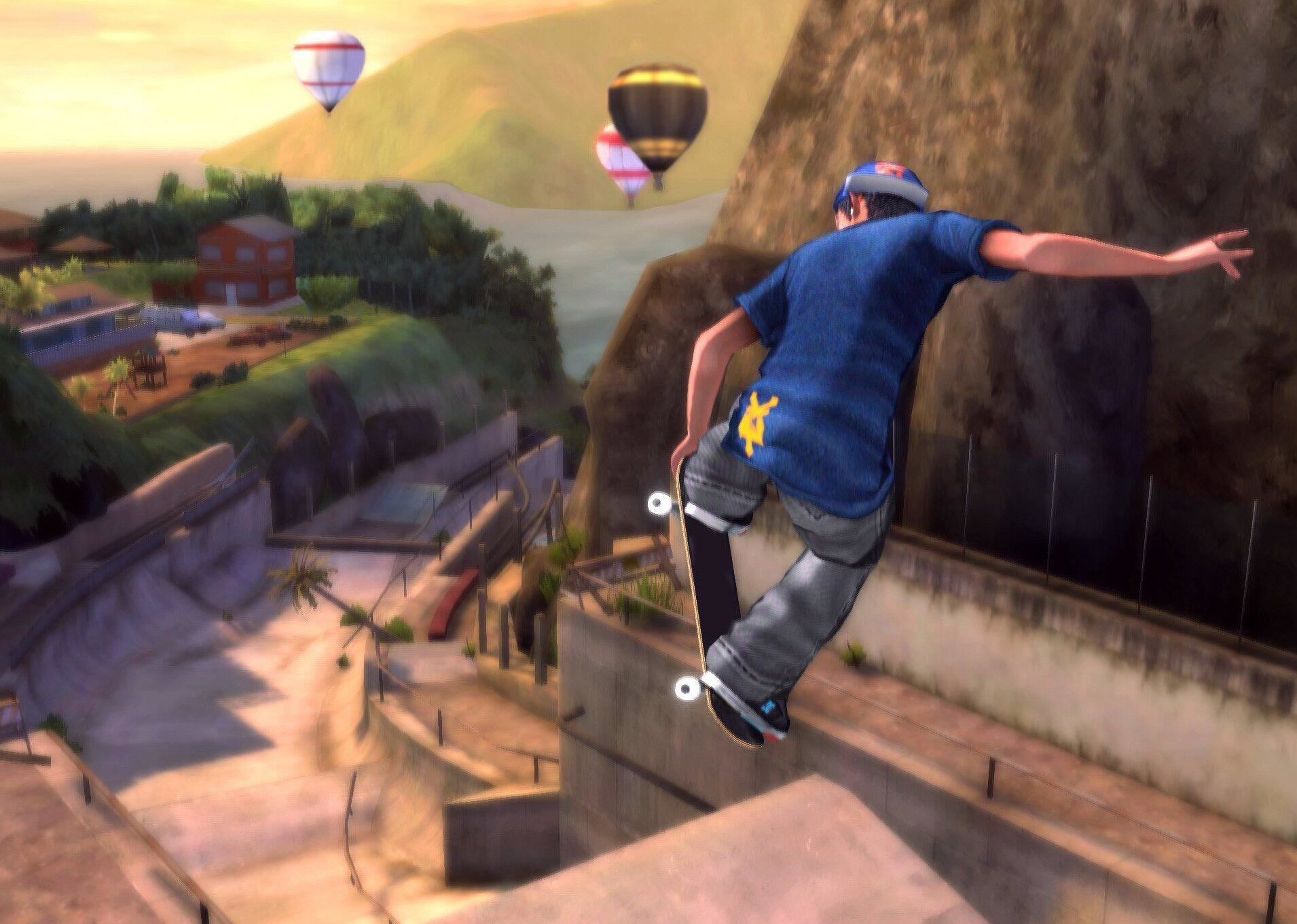 Skateboarder führt einen Trick über eine Mauer aus. Heißluftballons sind im Hintergrund.