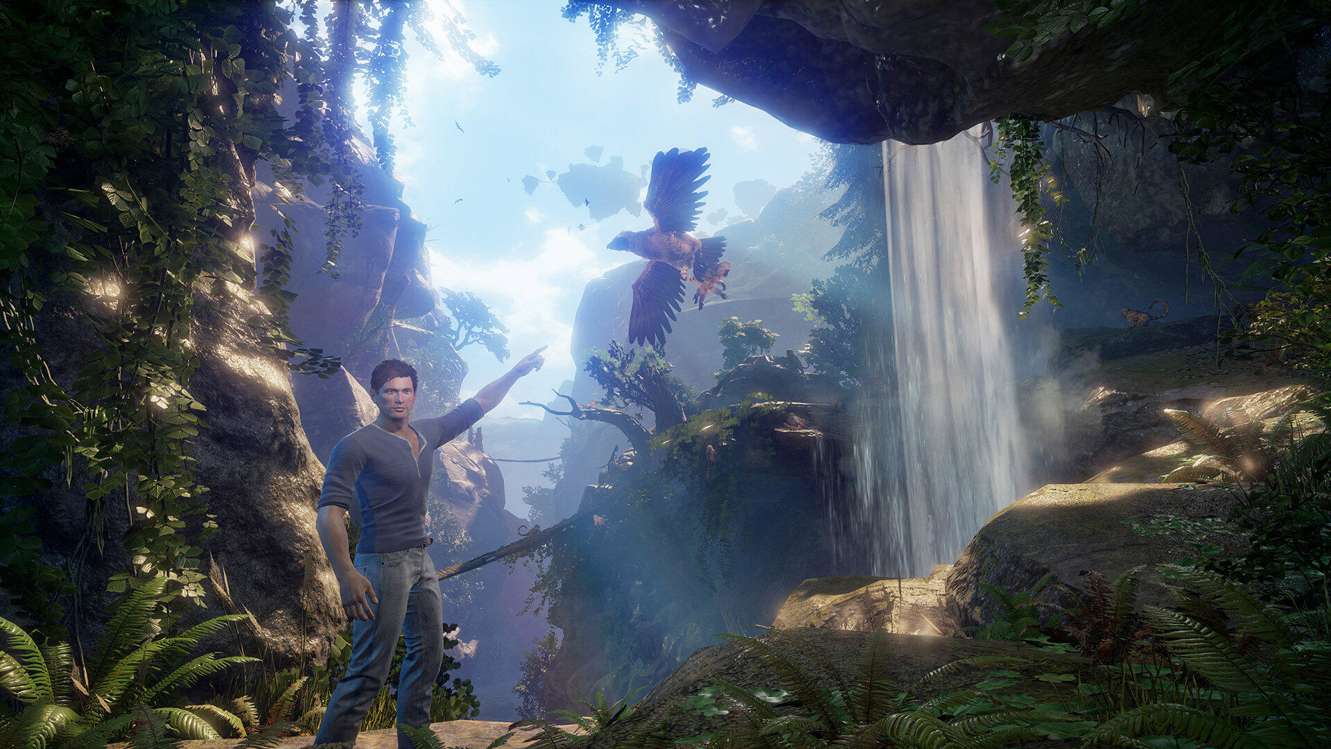 Mężczyzna wskazujący, wodospad, las, orzeł w locie, malownicze otoczenie, przygoda, czyste niebo.