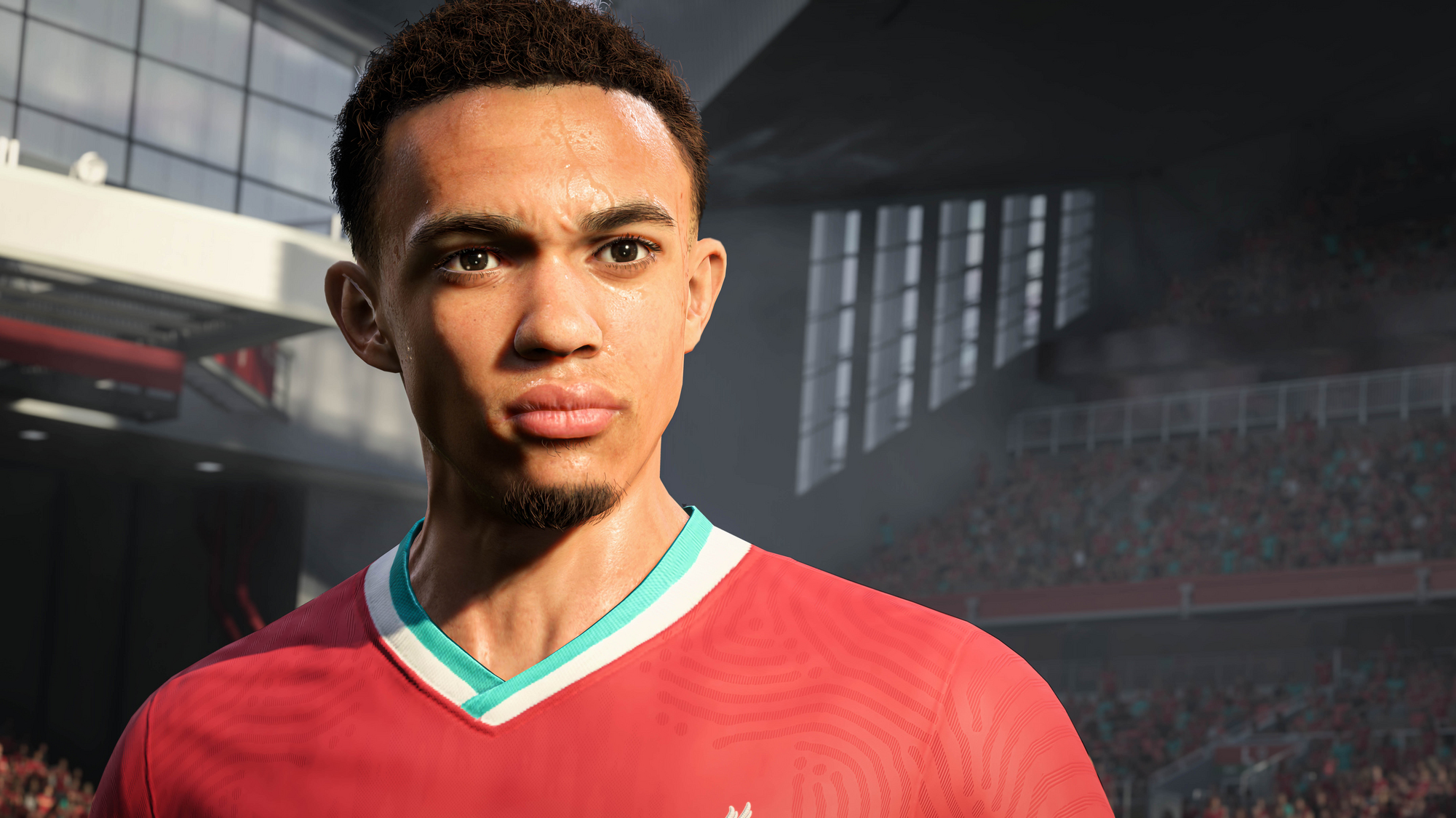 Trent Alexander-Arnold in einem roten Trikot. Er befindet sich in einem Stadion. Nahaufnahme seines Gesichts.