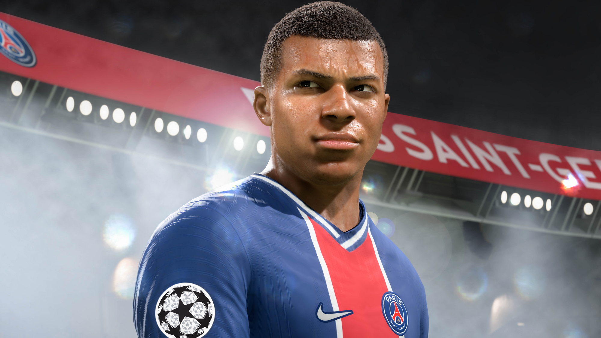 Kylian Mbappé in einem blauen Trikot im Stadion. Nahaufnahme seines Gesichts. Paris Saint-Germain-Logo sichtbar.