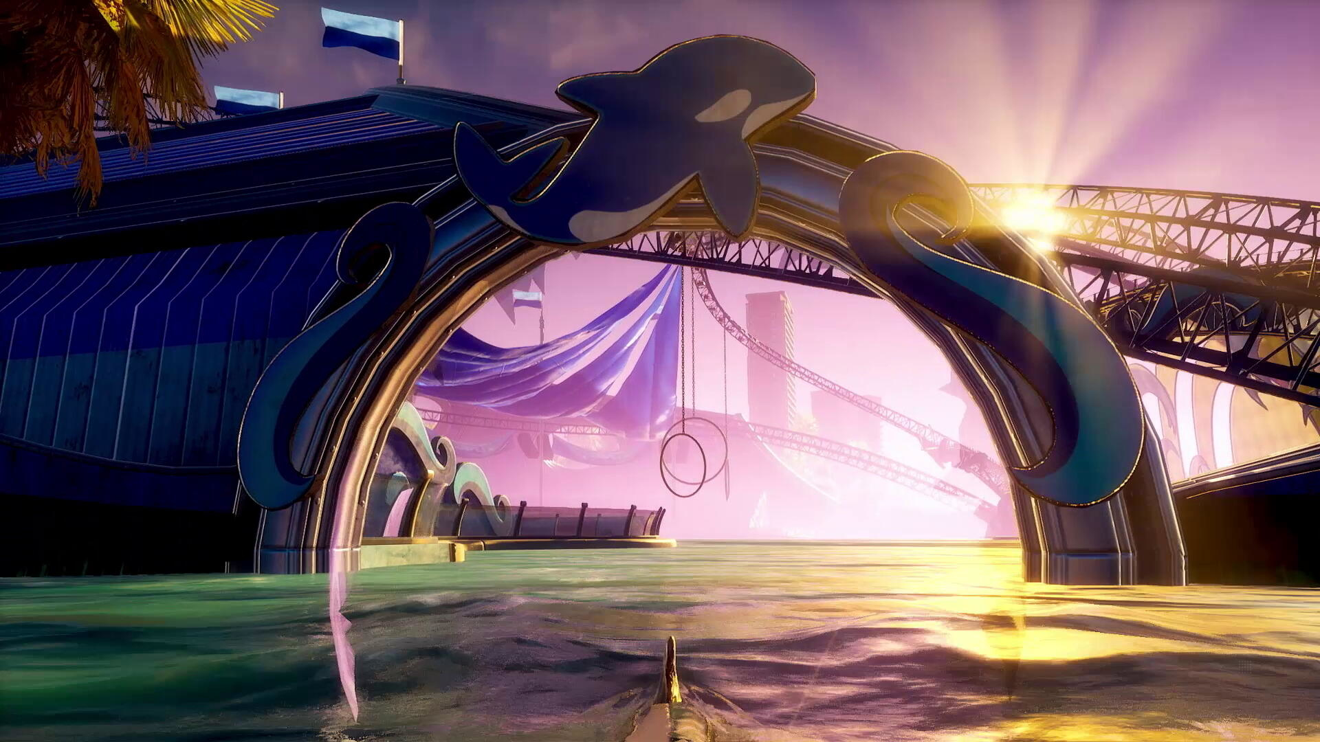 Łuk z wielorybem na basenie ze sceną i niebieskimi flagami.