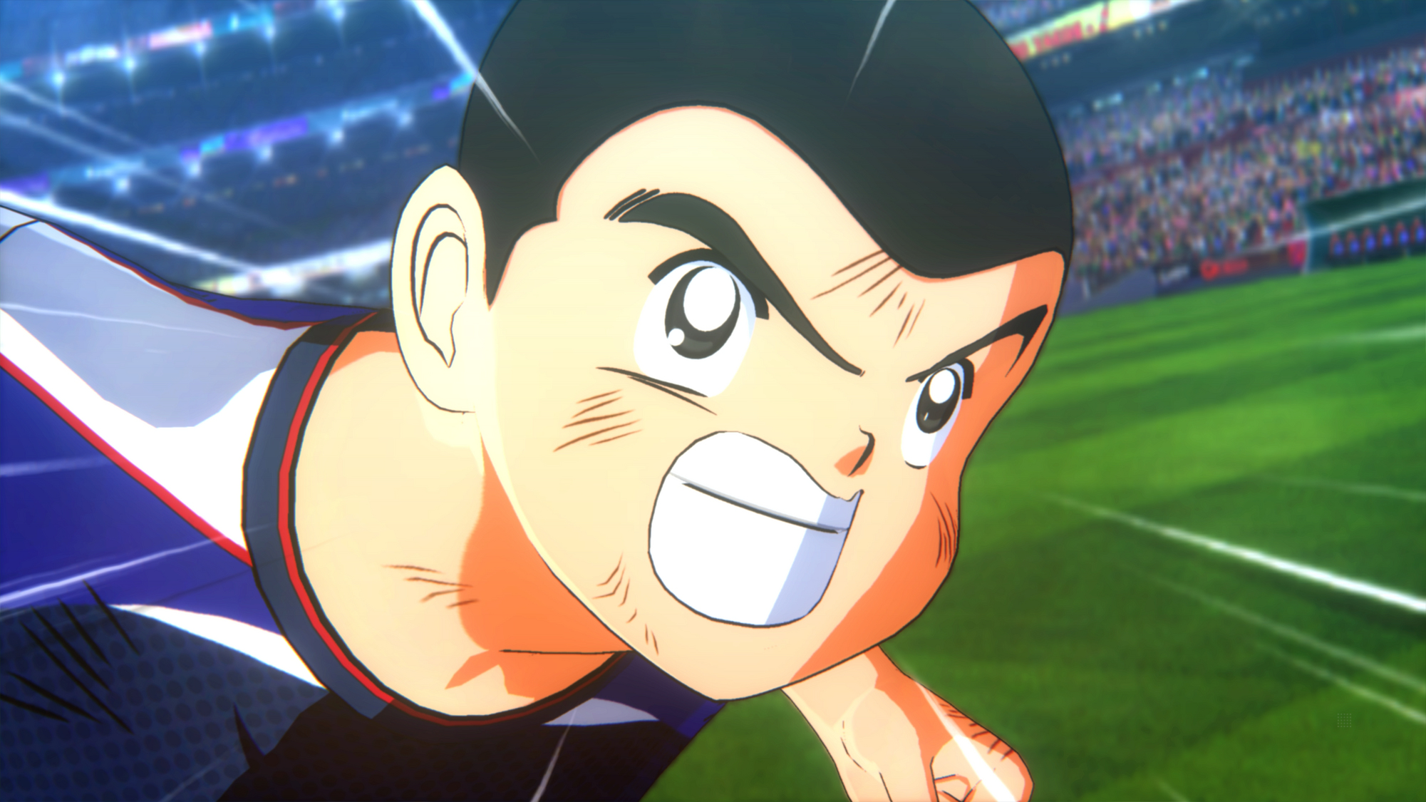 Nahaufnahme eines entschlossenen jungen Mannes in einem Fußballspiel. Er rennt mit konzentriertem Blick.