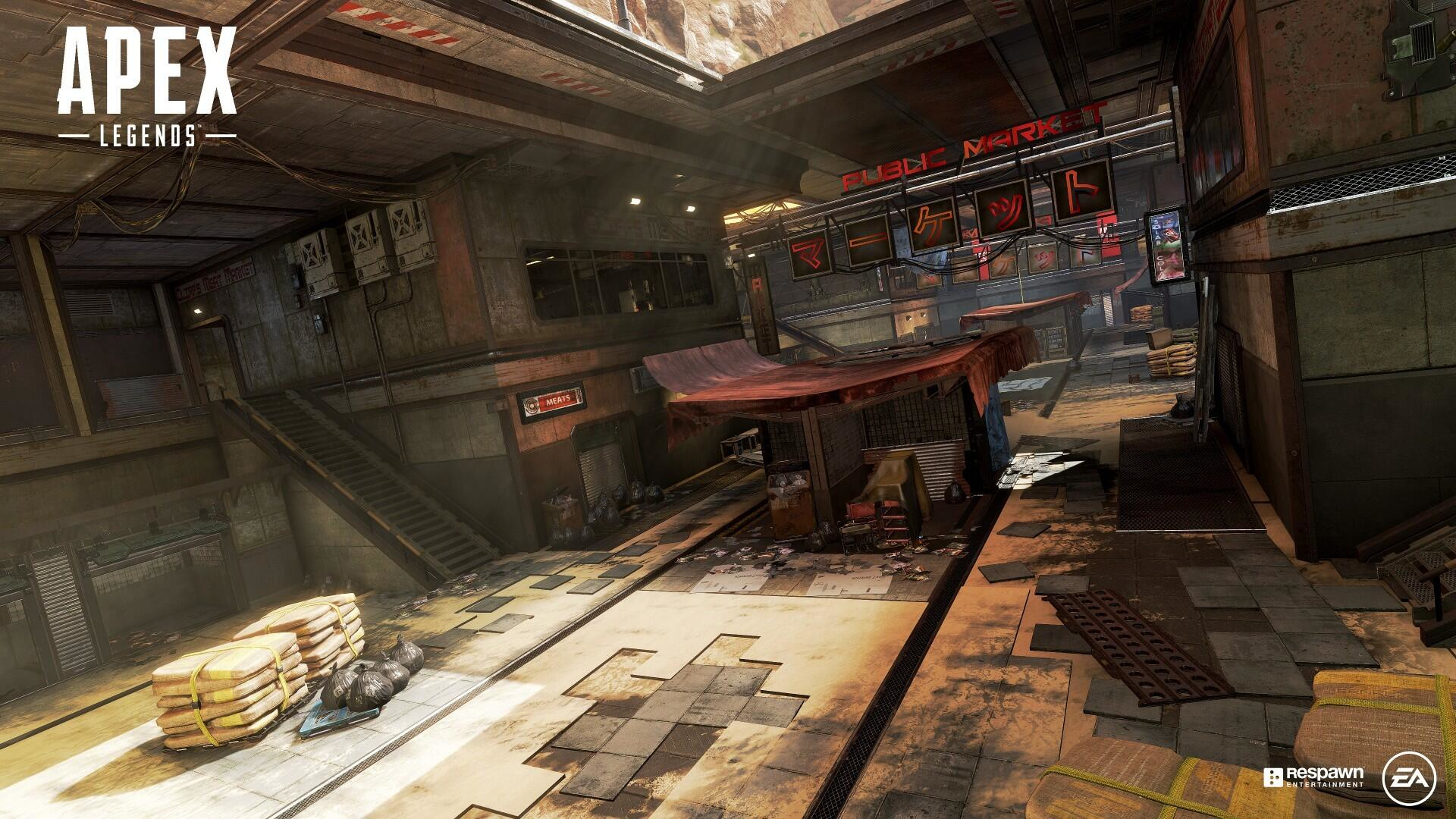 Eine futuristische Industrieumgebung mit Graffiti, Schildern und Metallstrukturen. Das Spiel Apex Legends ist sichtbar.