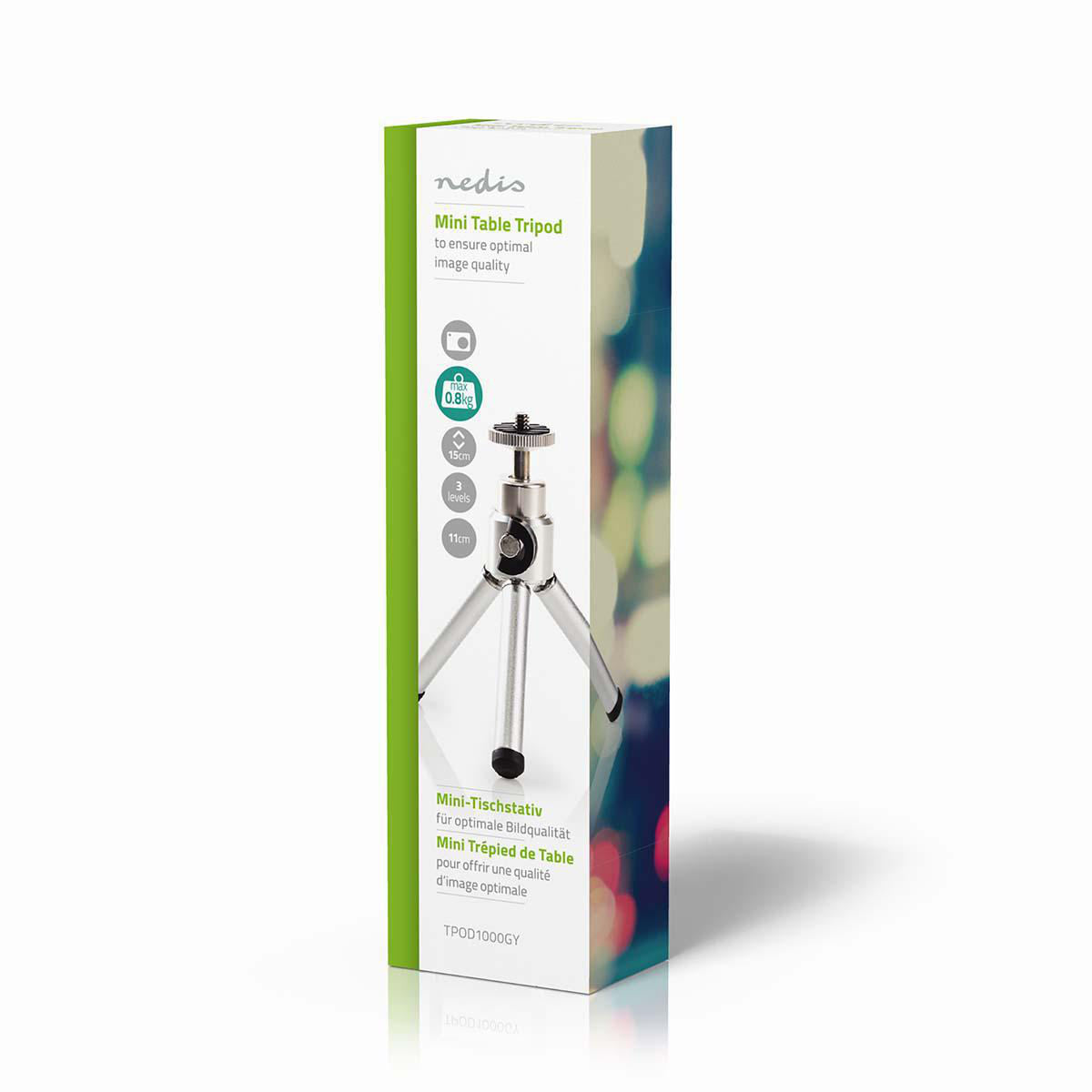 Mały srebrny statyw w pudełku, z tekstem i obrazkami na froncie.