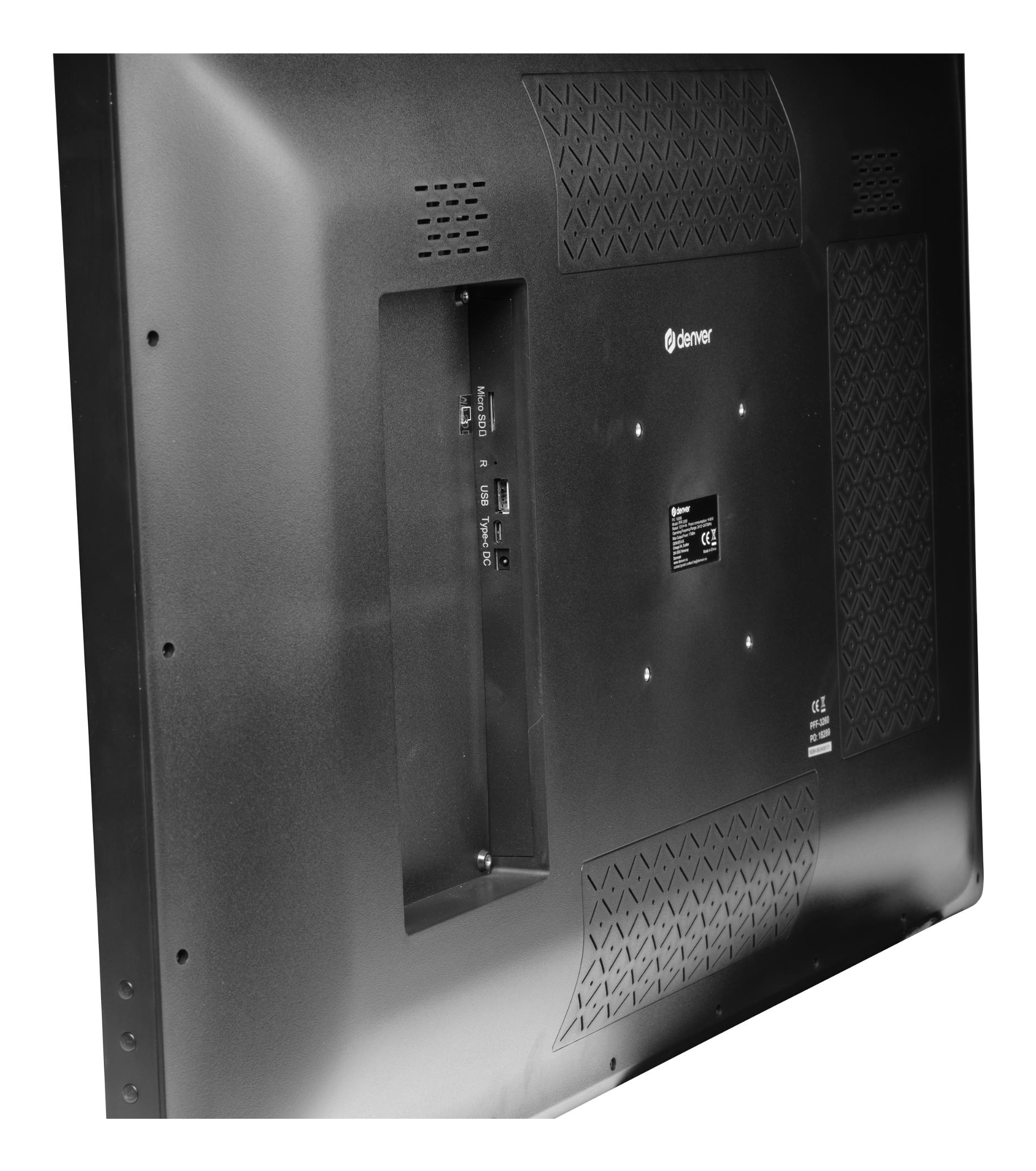 Zbliżenie na tył czarnego telewizora z widocznymi portami połączeniowymi i otworami wentylacyjnymi.