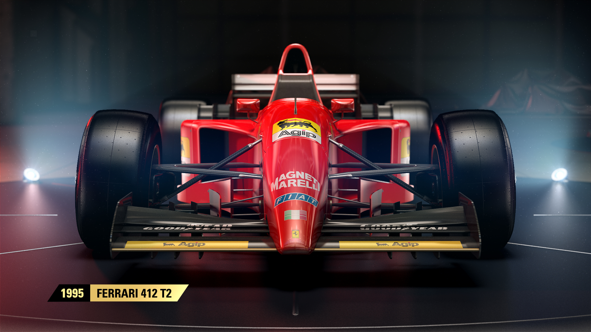 Ferrari 412 T2 rossa, vista frontale, loghi sponsor, pneumatici neri.