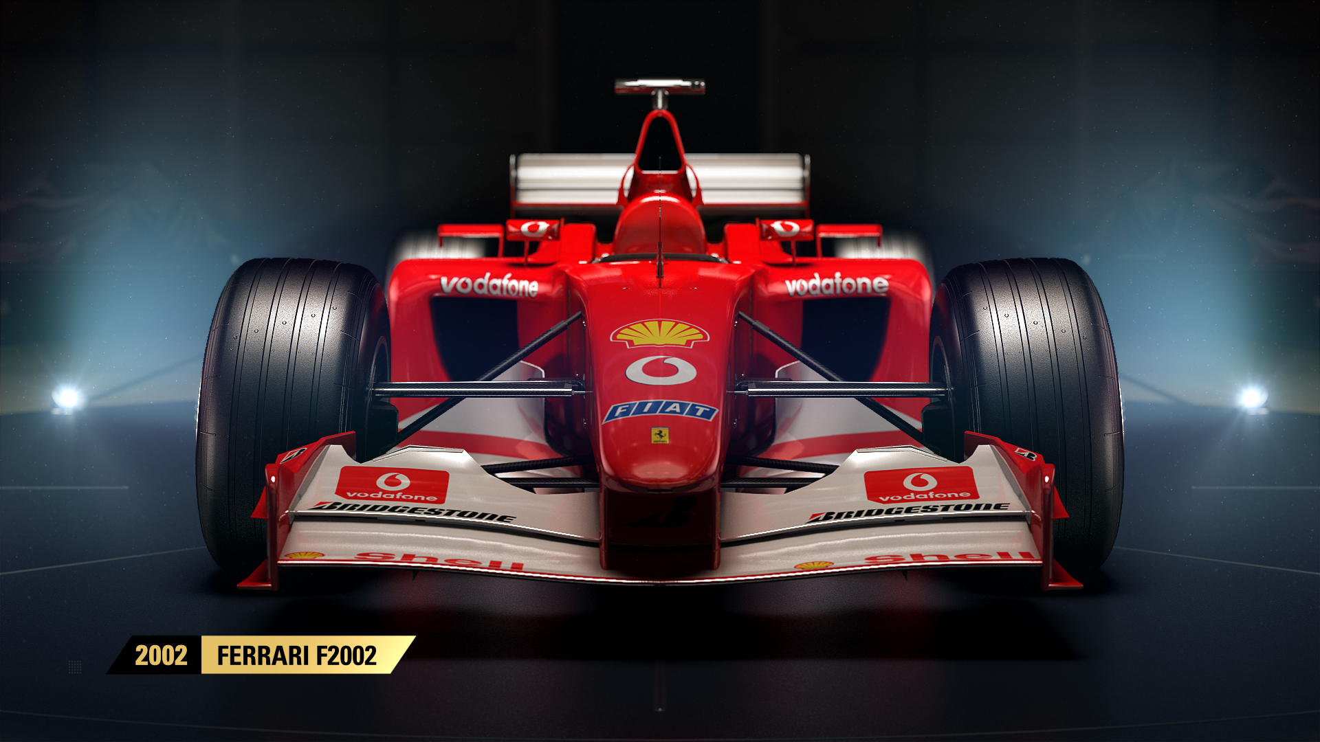 Ferrari F2002 rossa, vista frontale, pneumatici neri, loghi sponsor.