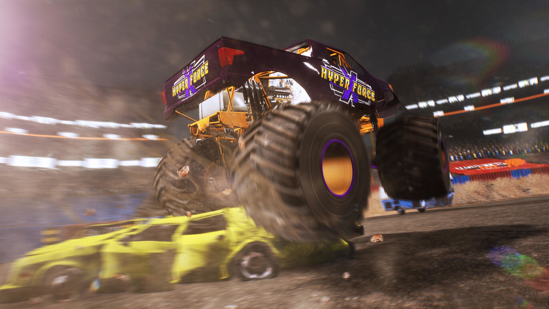 Monster truck miażdżący żółty samochód.