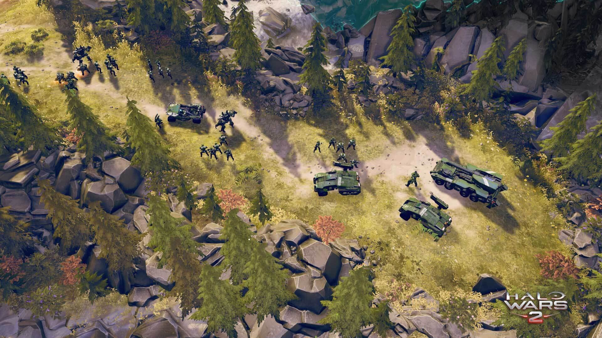 Halo Wars 2-gamescène met voertuigen, soldaten en bomen. Een gevecht is aan de gang.