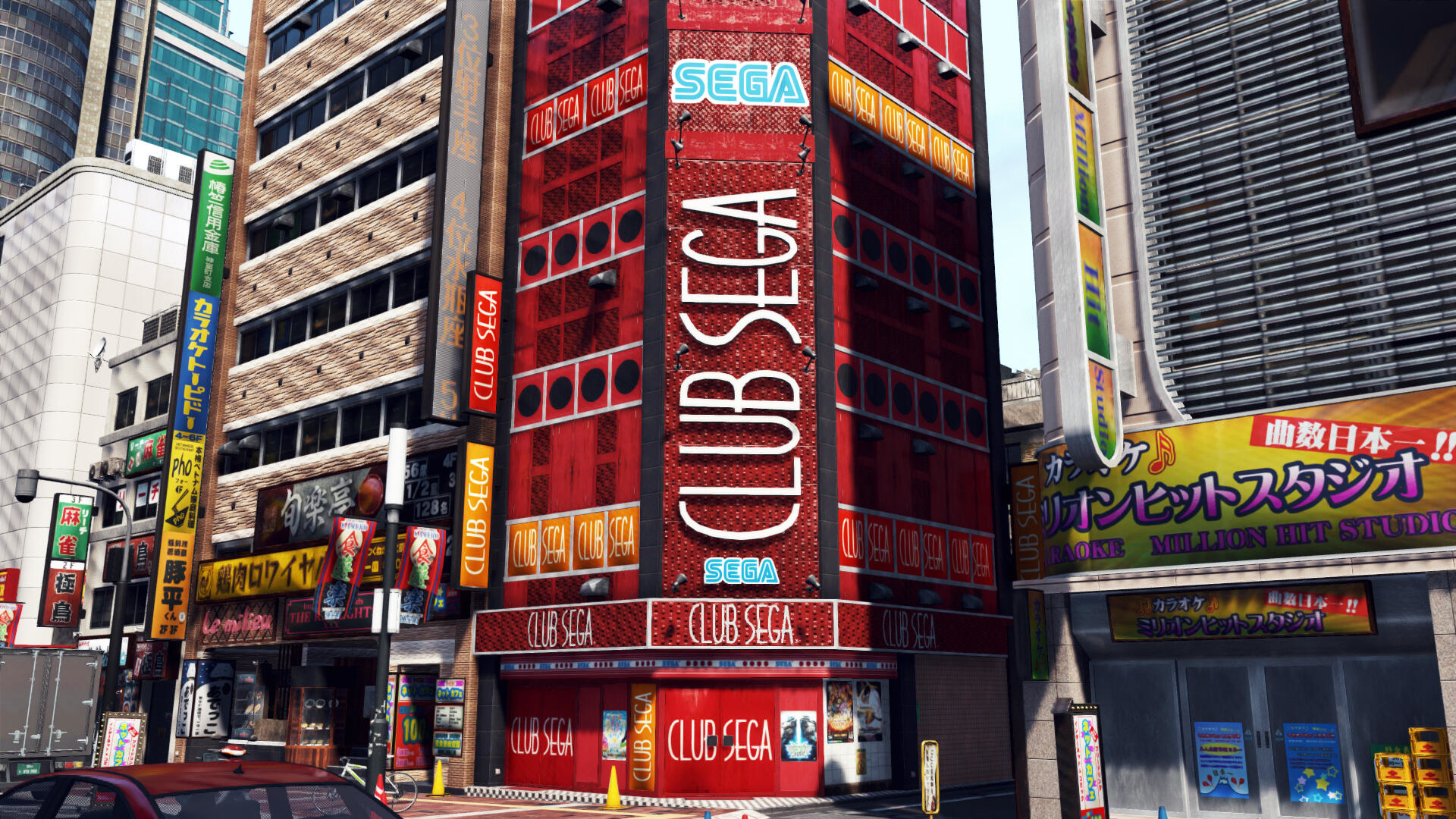 Budynek Club Sega na ulicy. Budynek jest czerwony z napisem Club Sega.